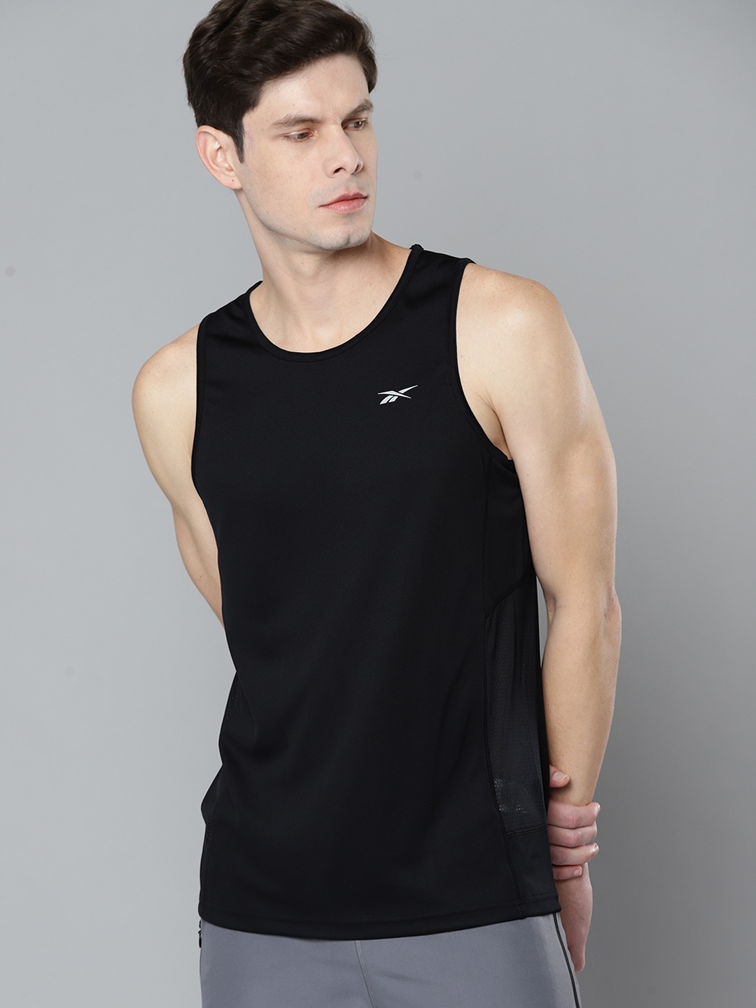 

Reebok Men Black Solid REECYCLED + SPEEDWICK Singlet Running T-shirt