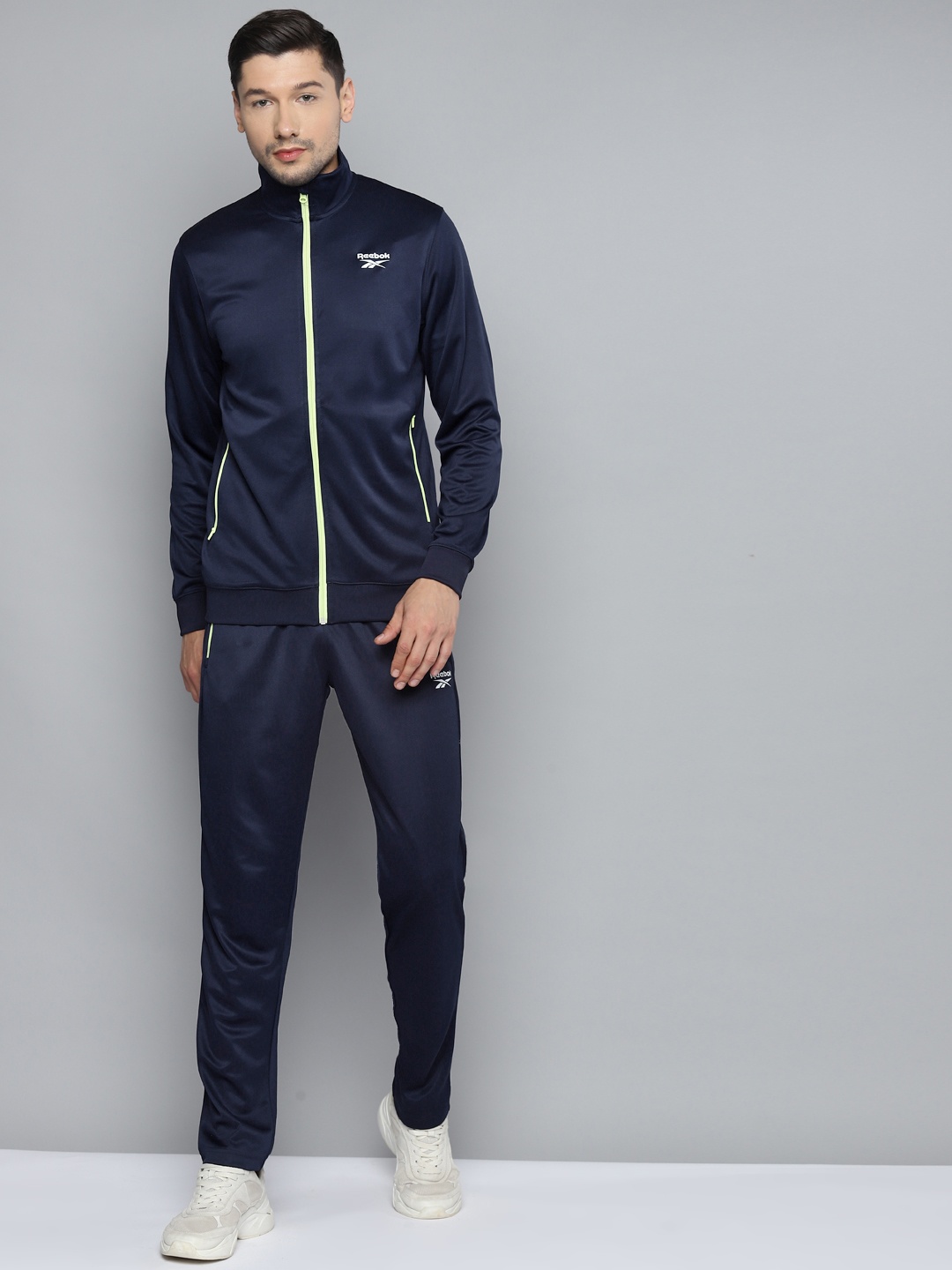 

Reebok Men Navy Blue Solid Core H Tracksuits