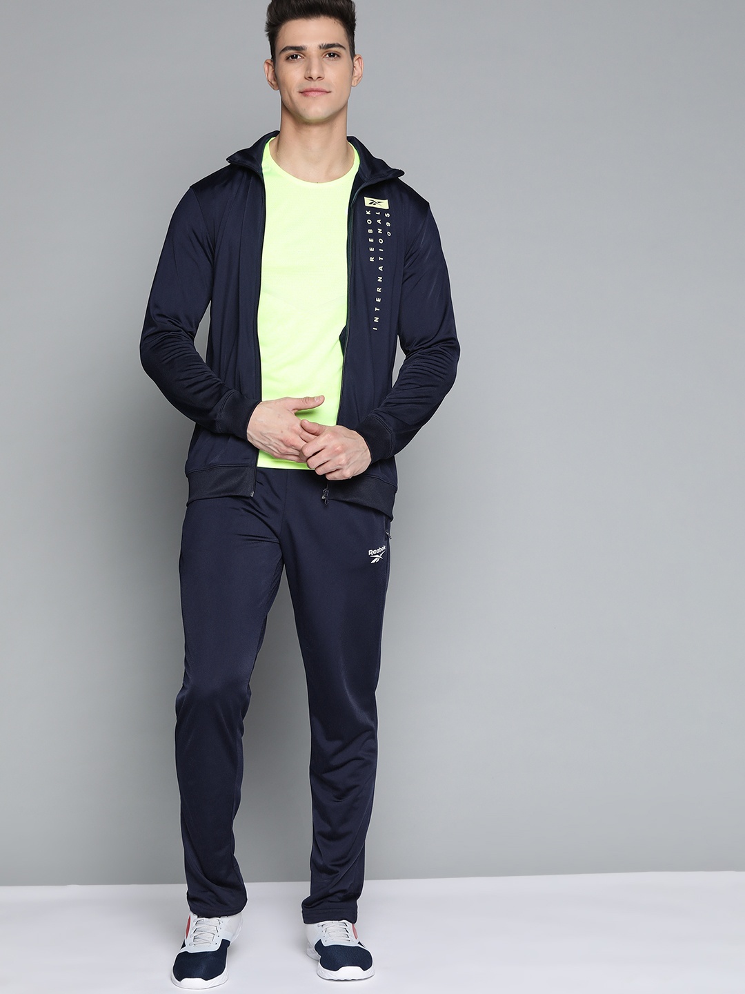 

Reebok Men Navy Blue Brand Logo Printed Workout ENH Solid Training Tracksuit
