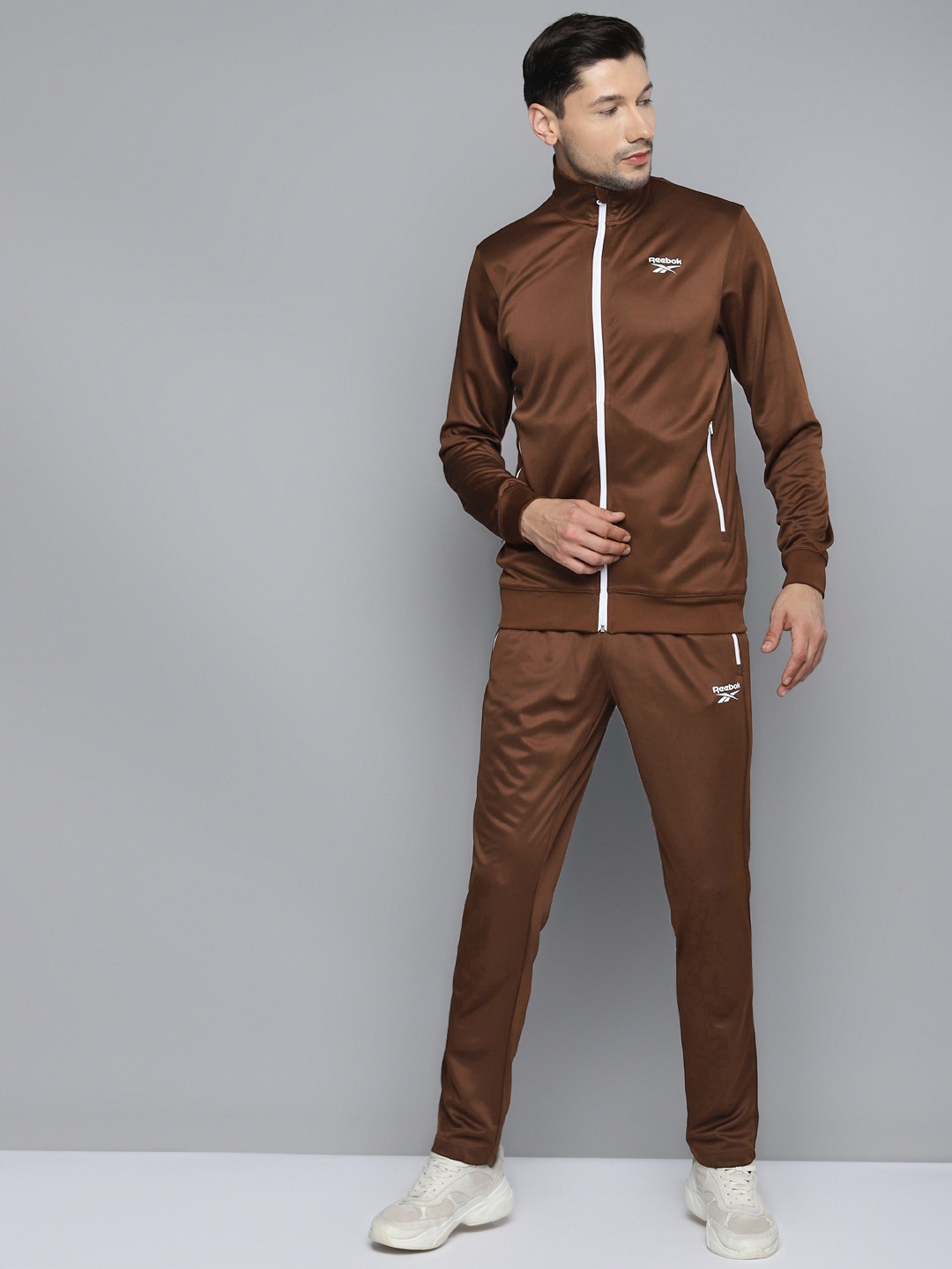 

Reebok Men Brown Solid Core H Training Tracksuits