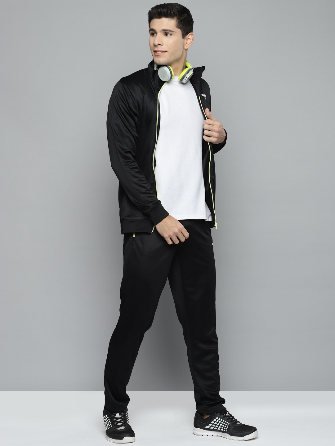 

Reebok Men Black Solid Training Core H Tracksuits