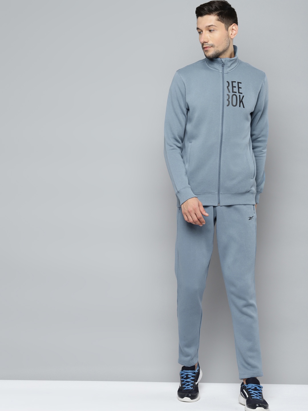 

Reebok Men Blue Vector Printed Detail Training Tracksuit