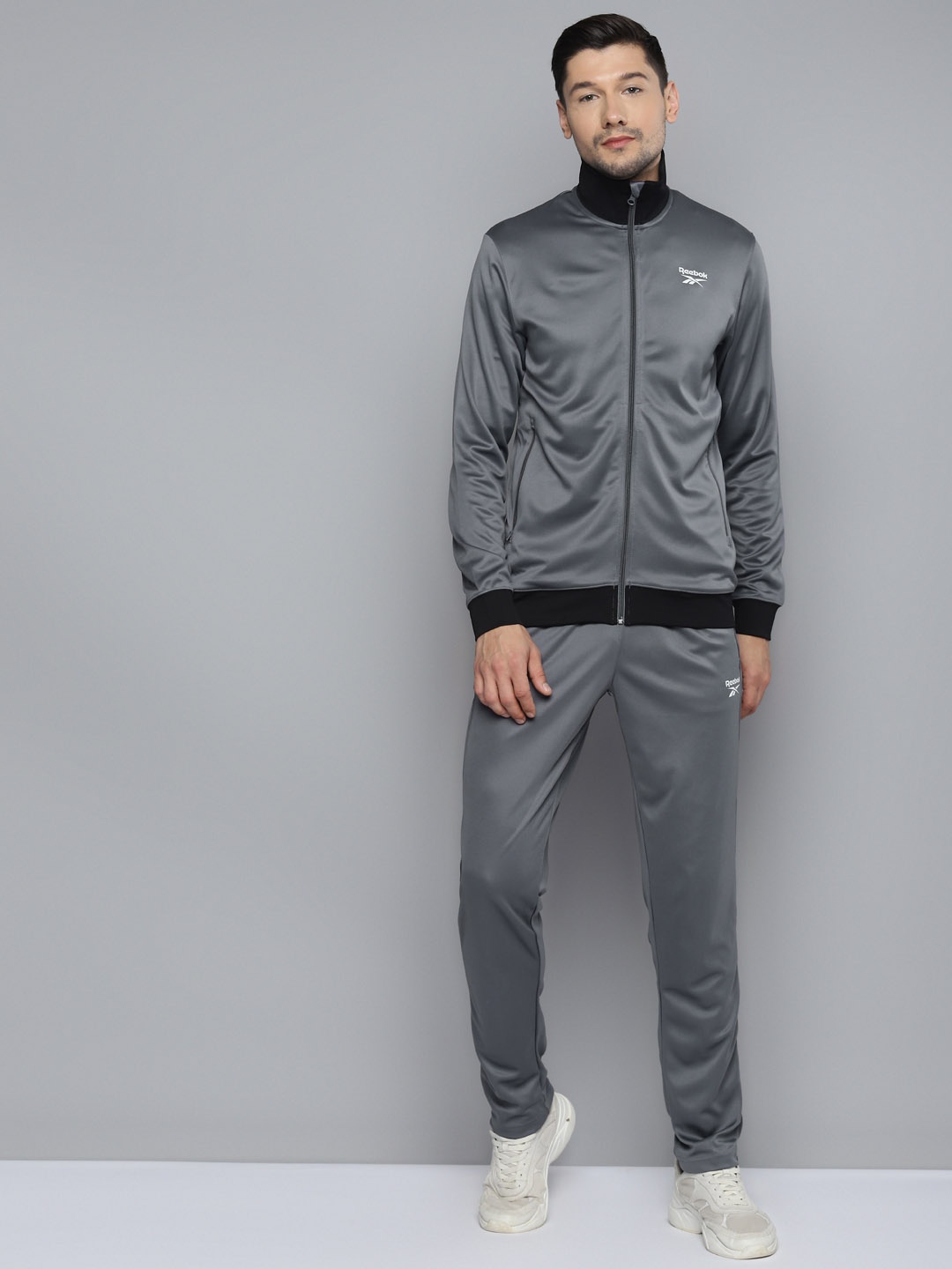 

Reebok Men Charcoal Grey Solid Core BAS Training Tracksuits