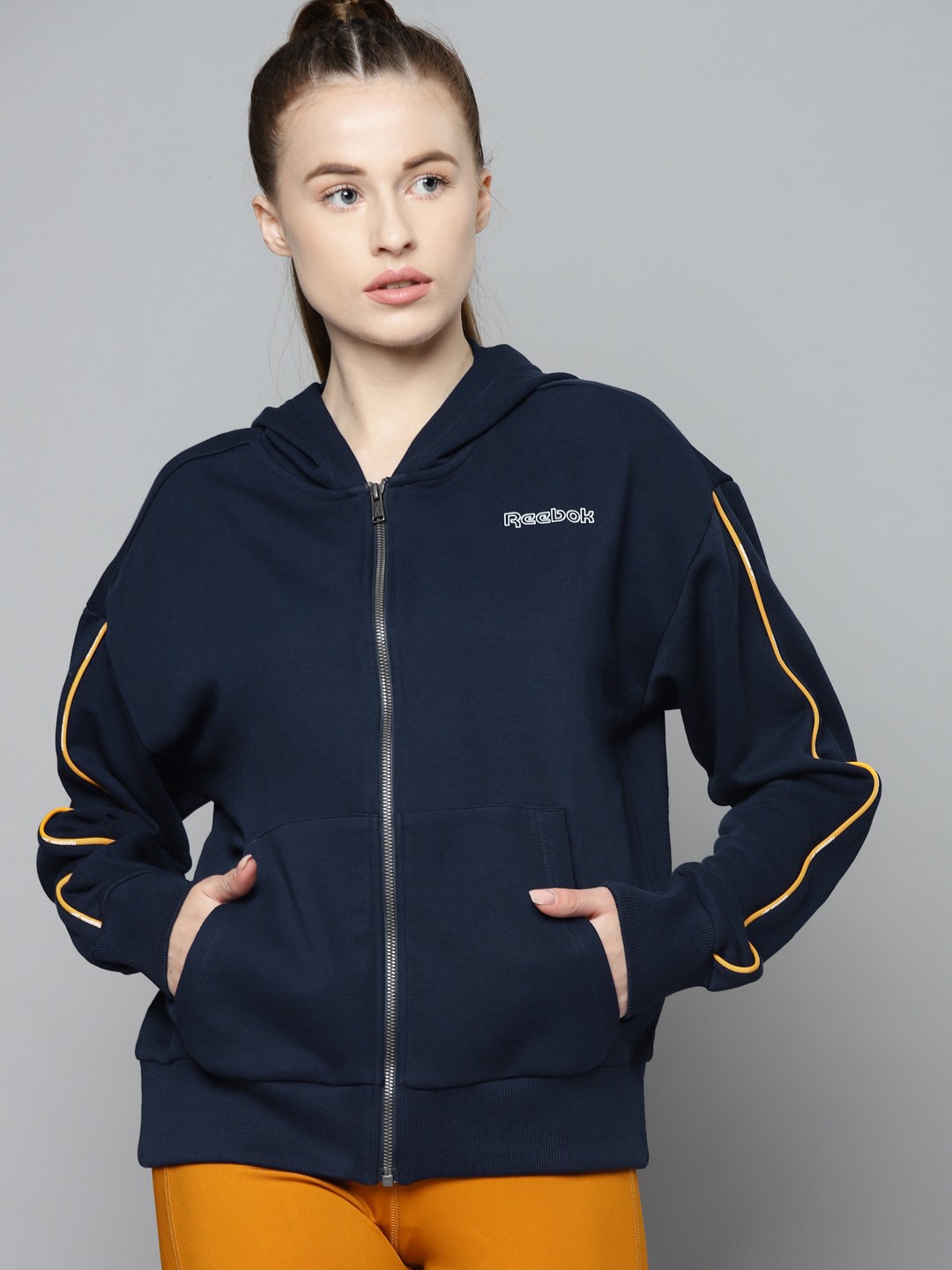 

Reebok Women Blue Brand logo Printed TE PIPING FULL ZIP Hooded Sweatshirt