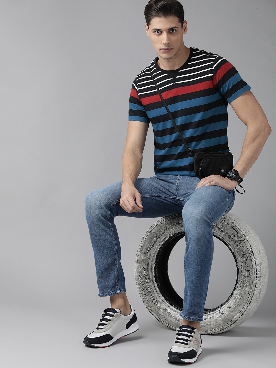 

Roadster Men Blue & Black Pure Cotton Striped T-shirt