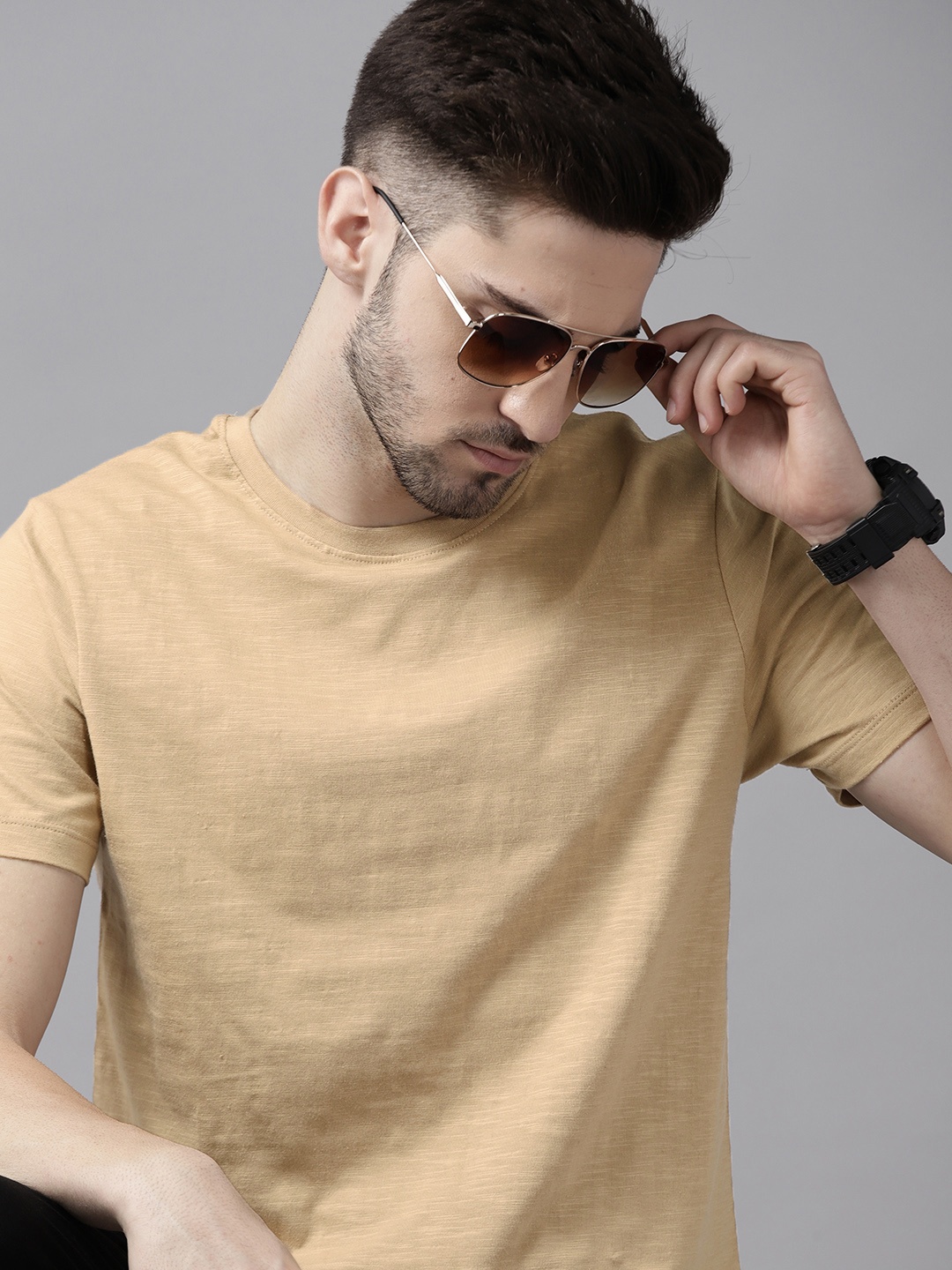 

Roadster Men Beige Solid Pure Cotton T-shirt
