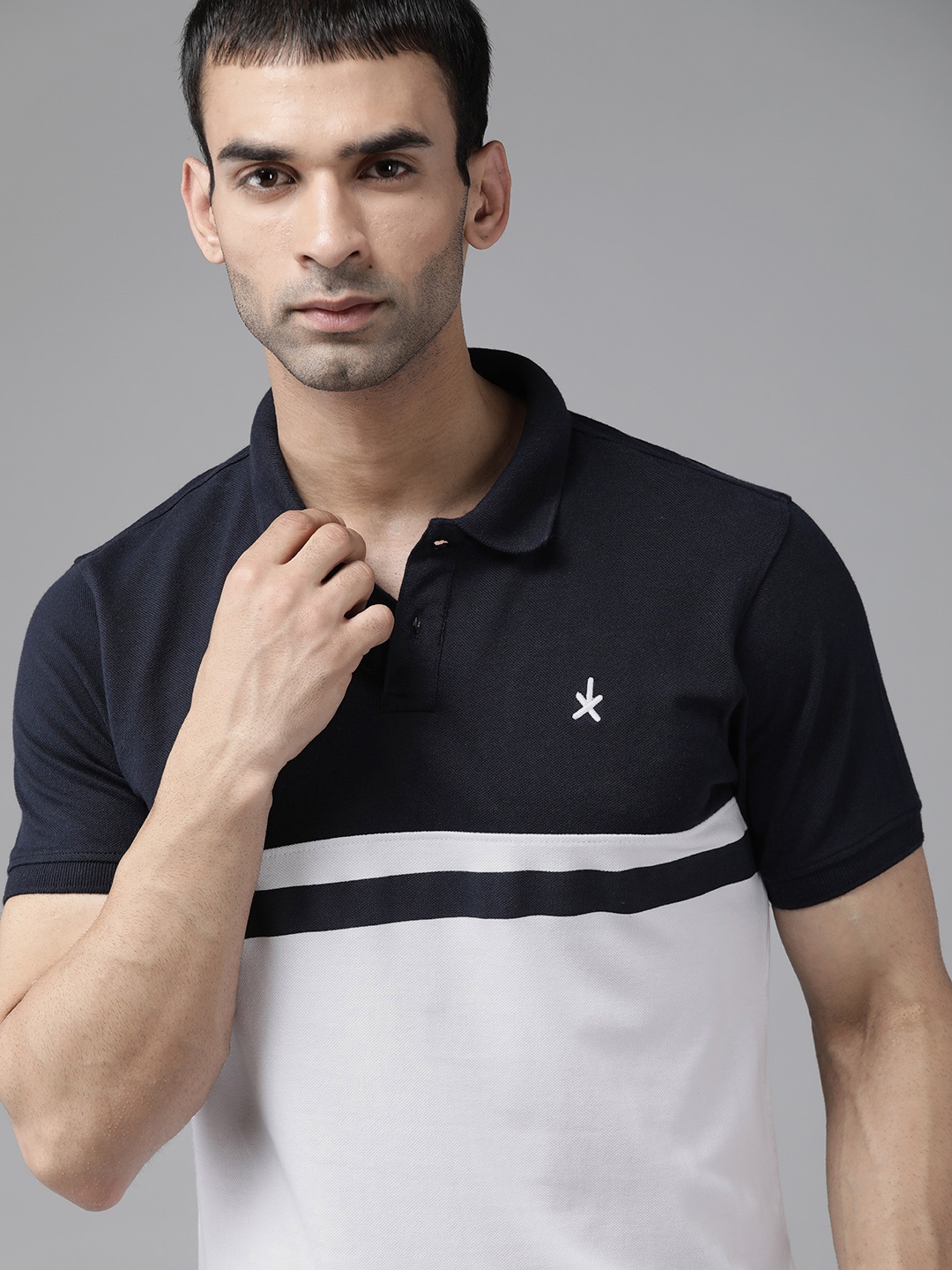 

Roadster Men Navy Blue & White Pure Cotton Colourblocked Polo Collar T-shirt