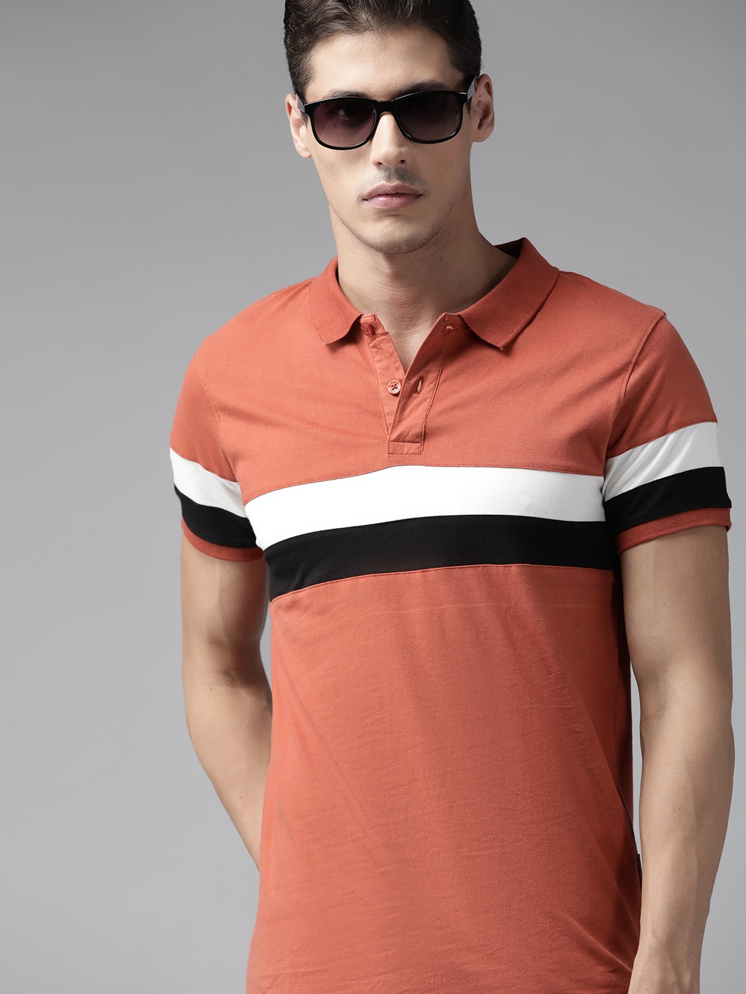 

Roadster Men Peach-Coloured Pure Cotton Striped Polo Collar T-shirt