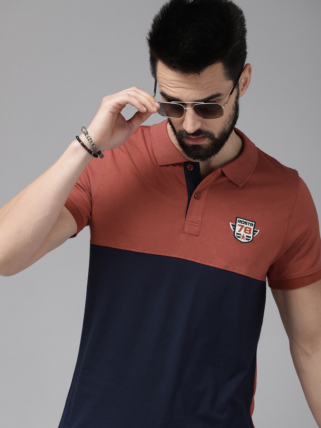 

The Roadster Lifestyle Co Men Navy Blue & Brown Colourblocked Polo Collar T-shirt