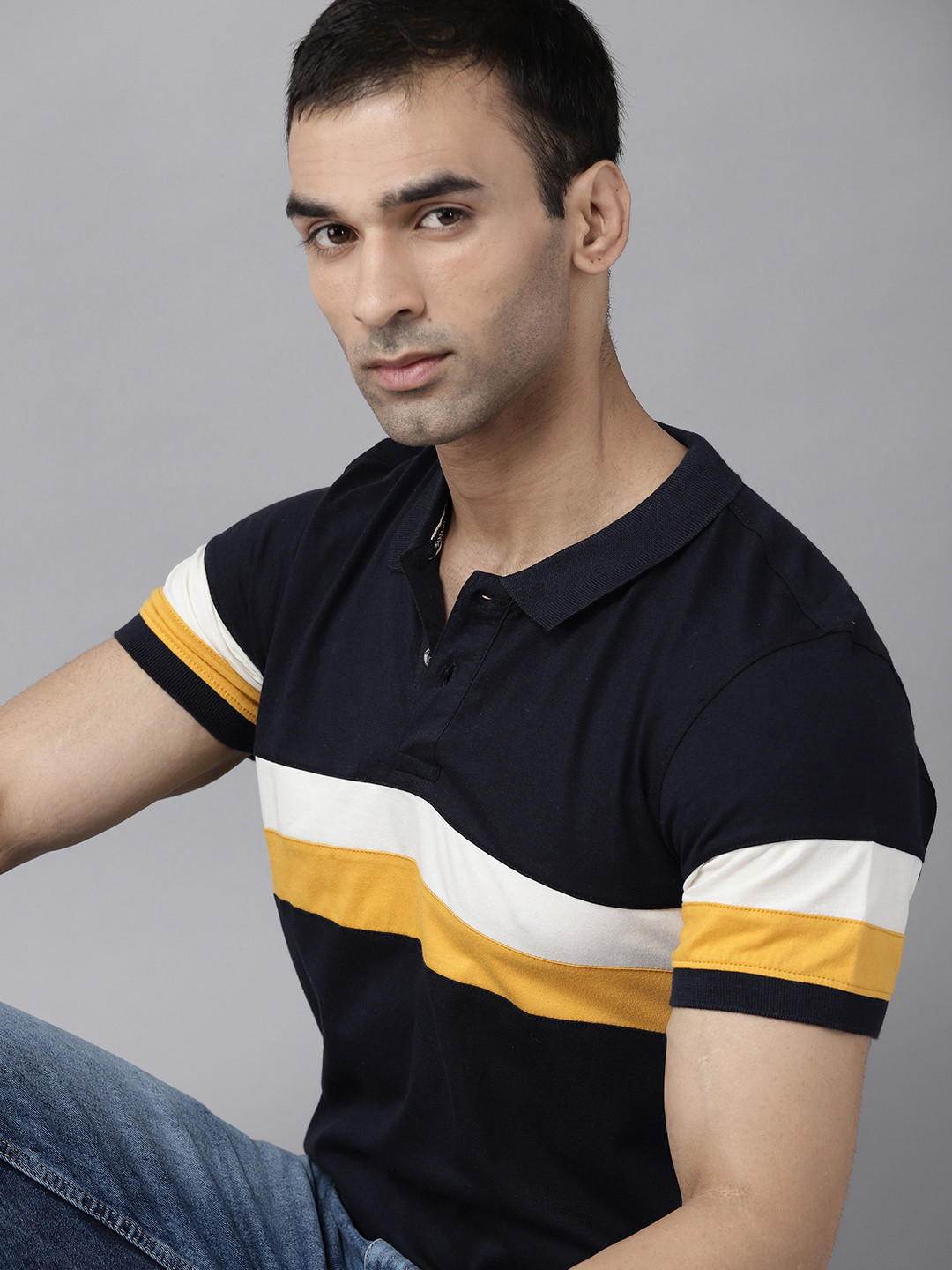 

Roadster Men Navy Blue & Yellow Striped Pure Cotton Polo Collar T-shirt