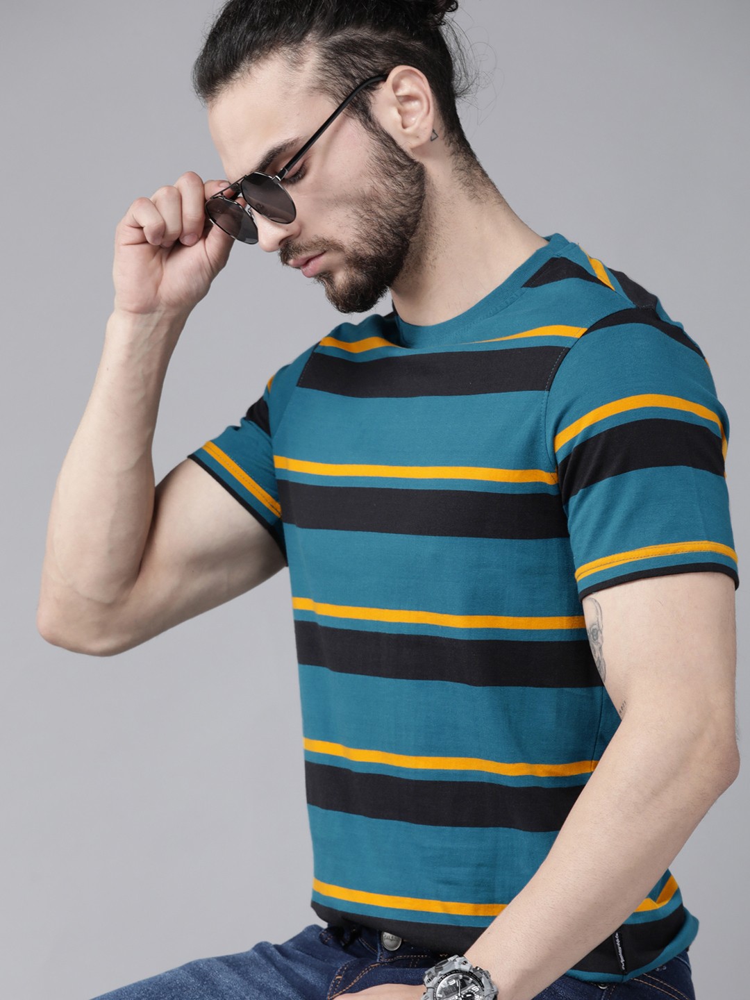 

Roadster Men Teal Blue & Black Cotton Striped T-shirt