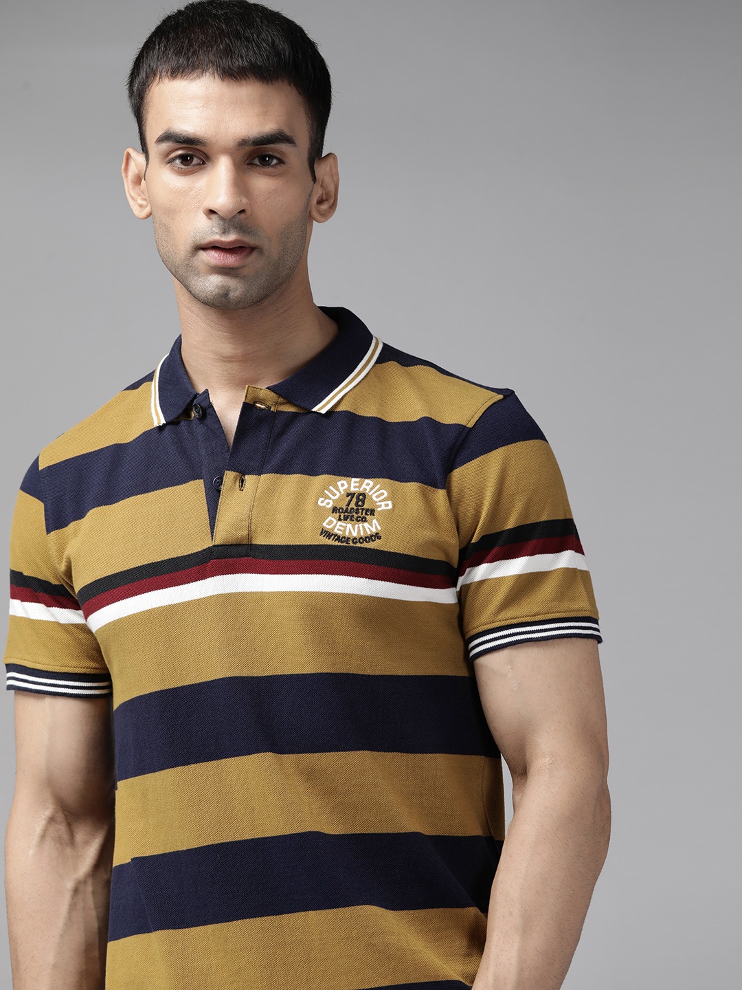 

Roadster Men Navy Blue & Khaki Pure Cotton Striped Polo Collar T-shirt