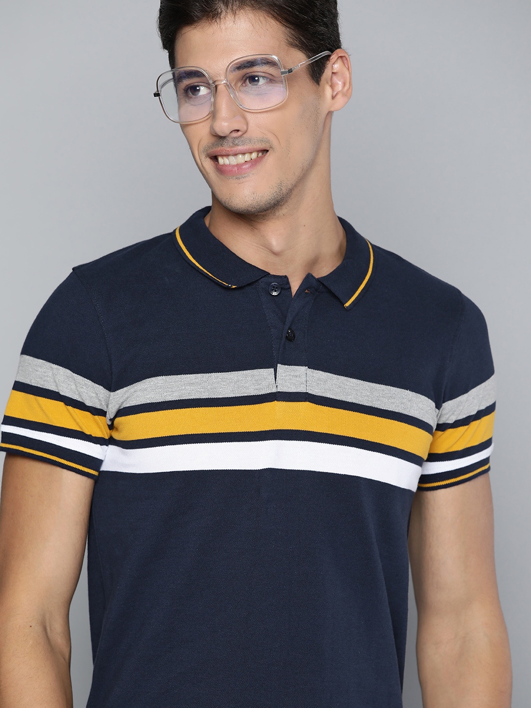 

Roadster Men Navy Blue & Yellow Striped Cotton Polo Collar T-shirt