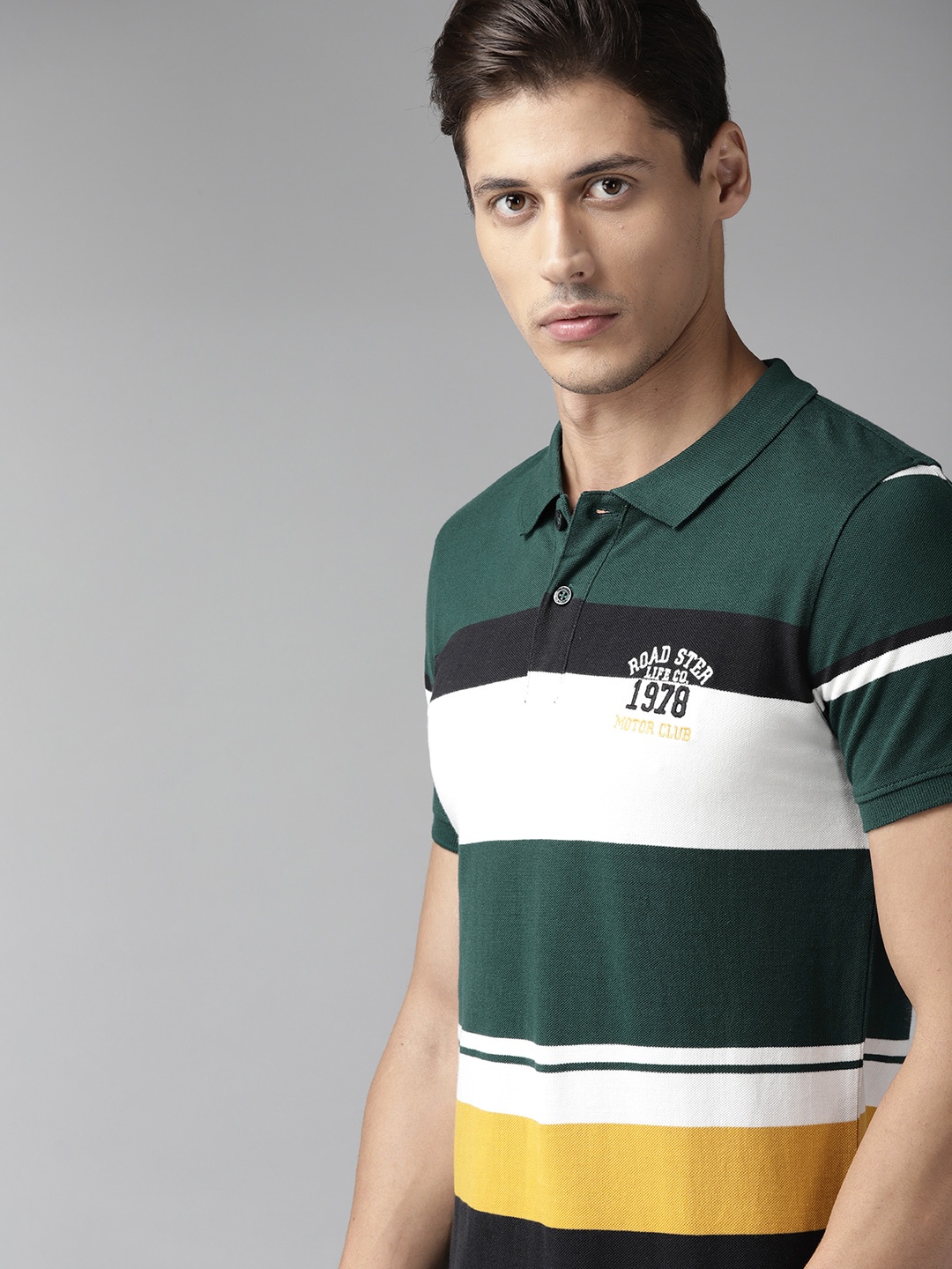 

Roadster Men Green & White Striped Polo Collar Cotton T-shirt