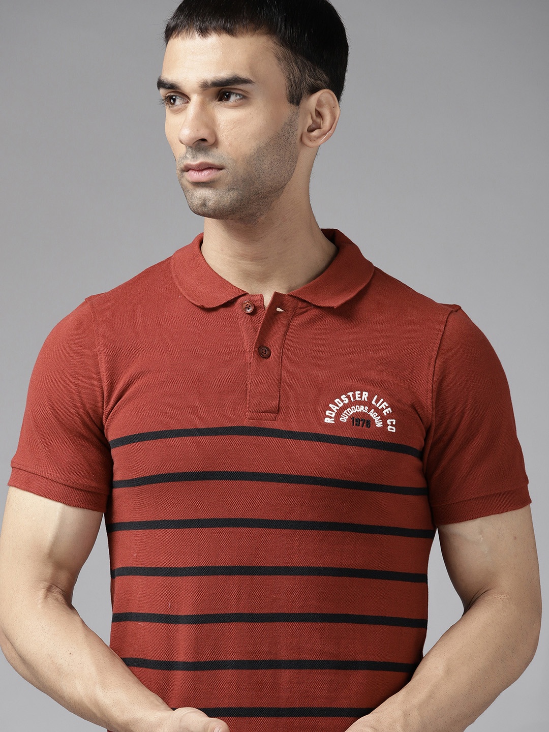

Roadster Men Rust Red & Black Cotton Striped Polo Collar T-shirt
