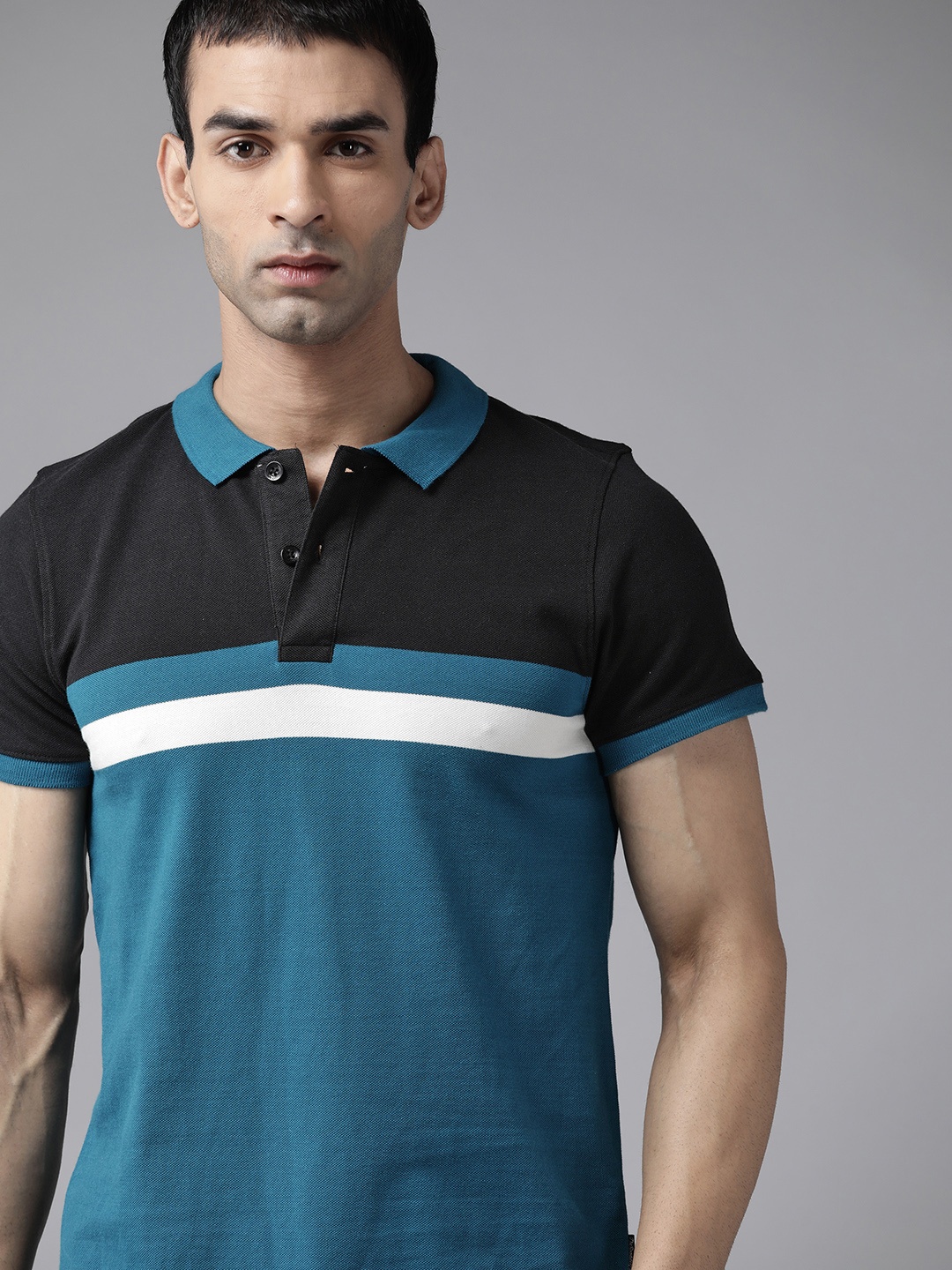 

Roadster Men Blue & Black Colorblocked Polo Collar T-shirt