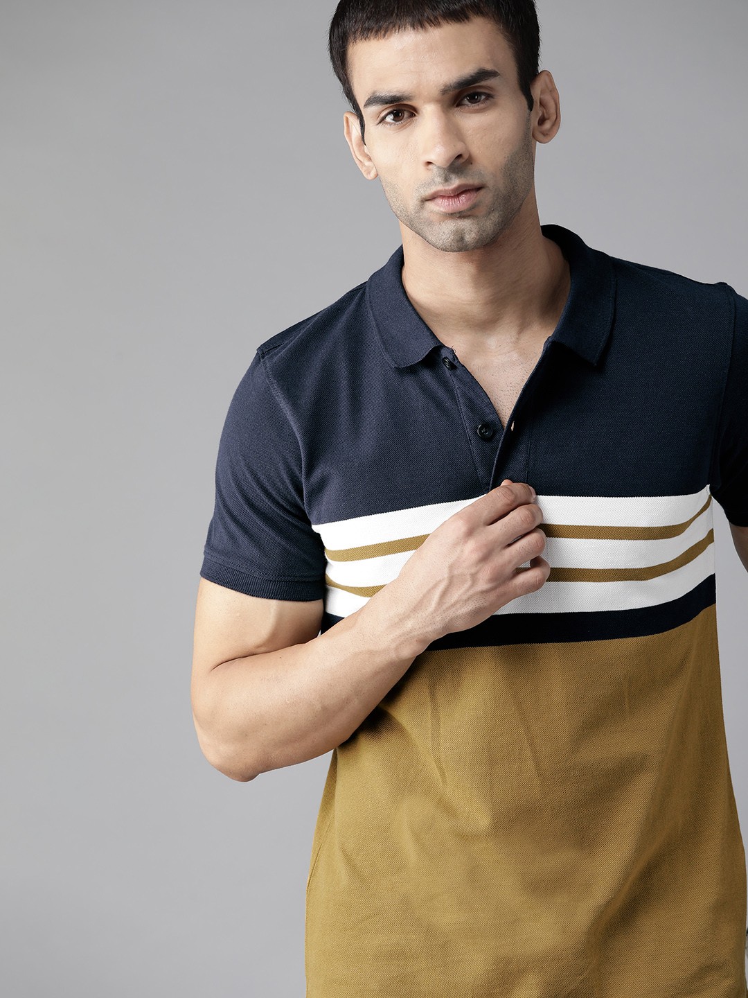 

Roadster Men Khaki & Navy Blue Pure Cotton Striped Polo Collar T-shirt