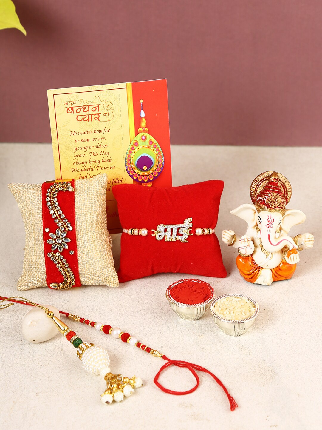 

CraftVatika Set Of 4 Rakhi With Ganesh Idol, Red