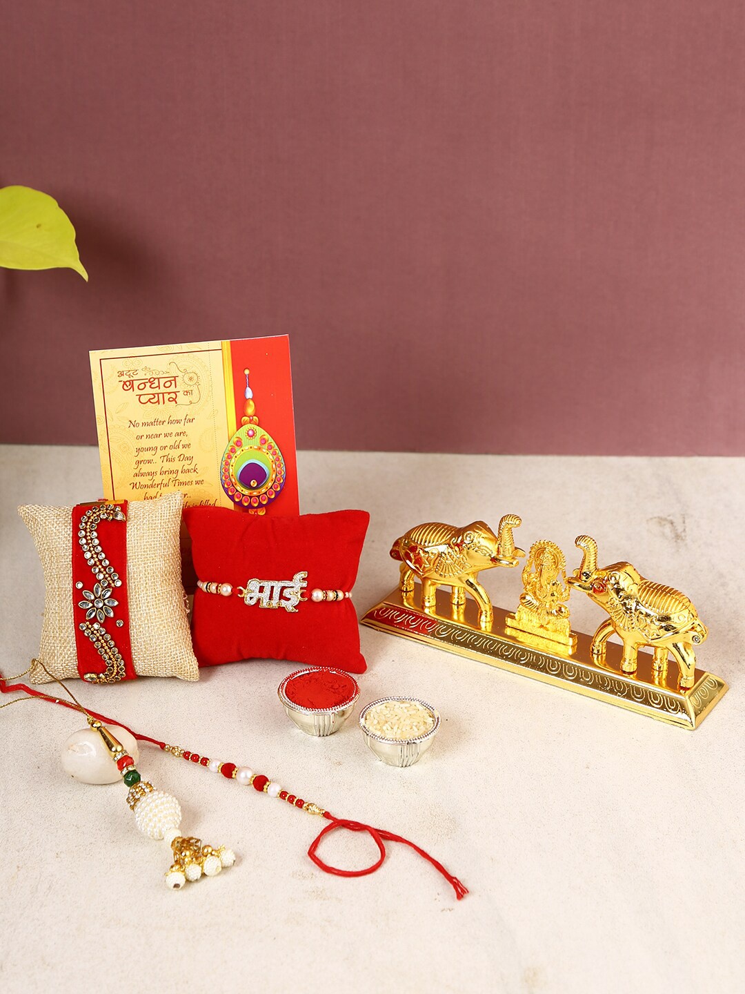 

CraftVatika Set of 4 Rakhi with Ganesha Figurine Sindoor Dani Chandan Box, Multi