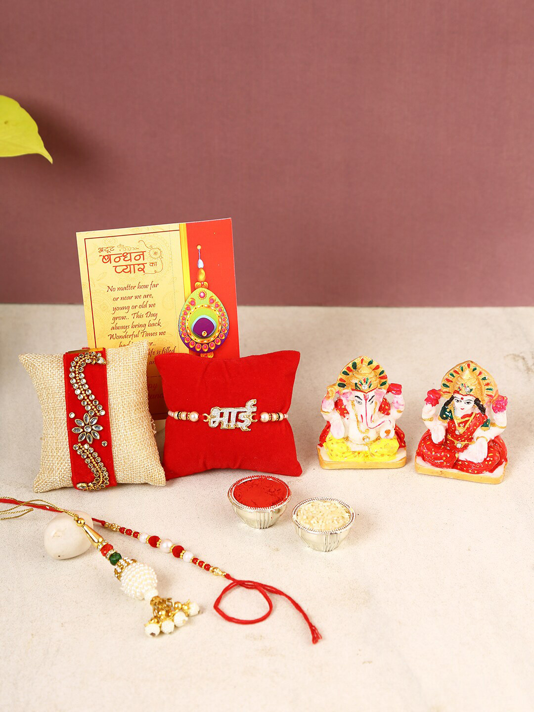 

CraftVatika Set Of 4 Rakhi With Laxmi Ganesha Idol, Red