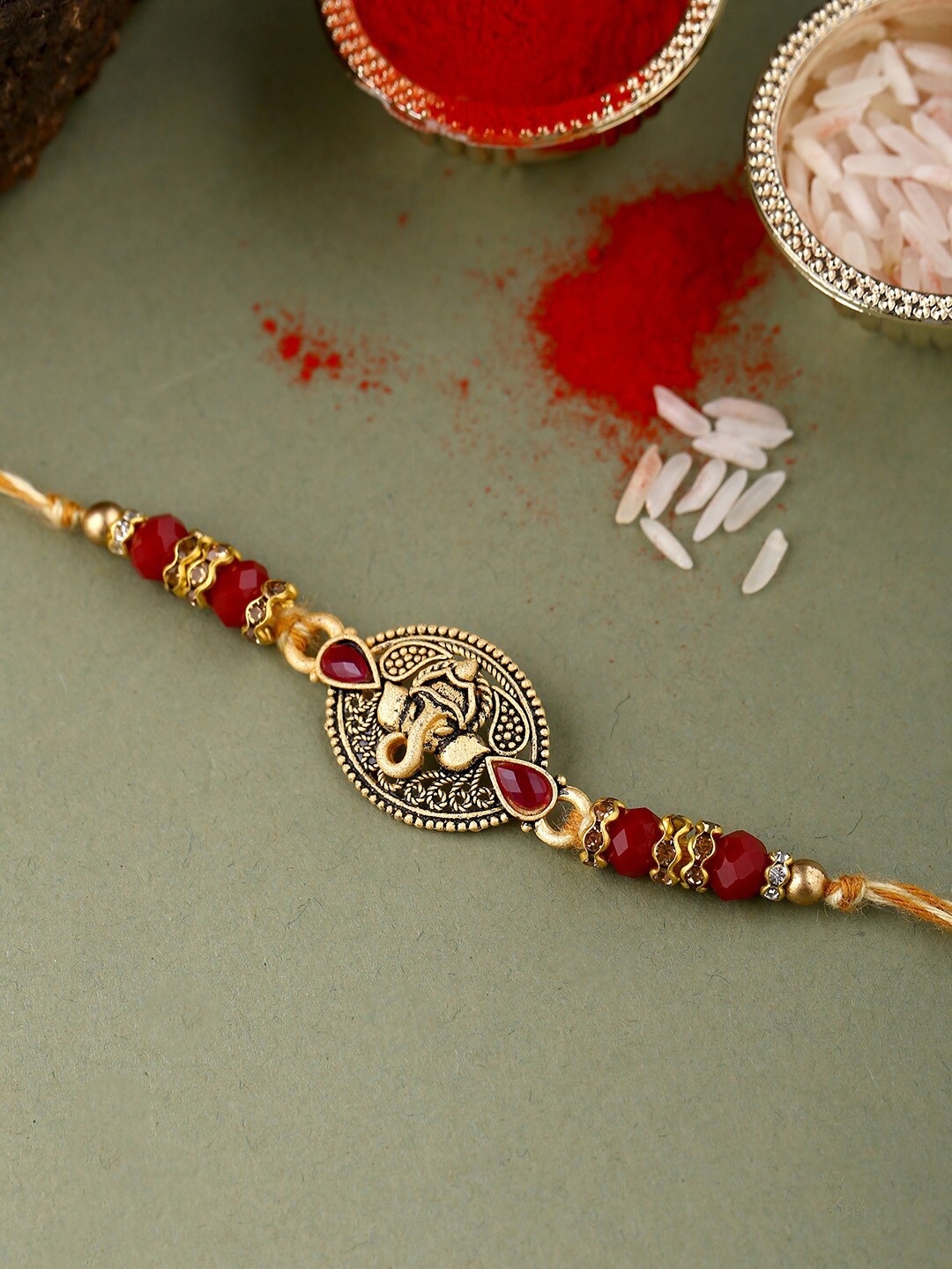 

Voylla Red & Gold Lord Ganesha Beaded Rakhi