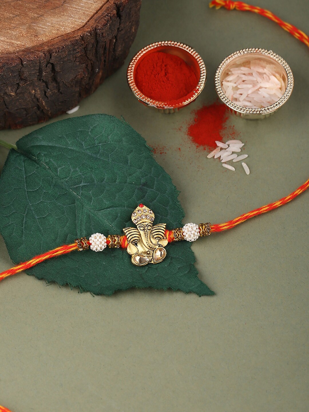 

Voylla Antique Lord Ganesha Rakhi with Roli Chaawal Pack, Red