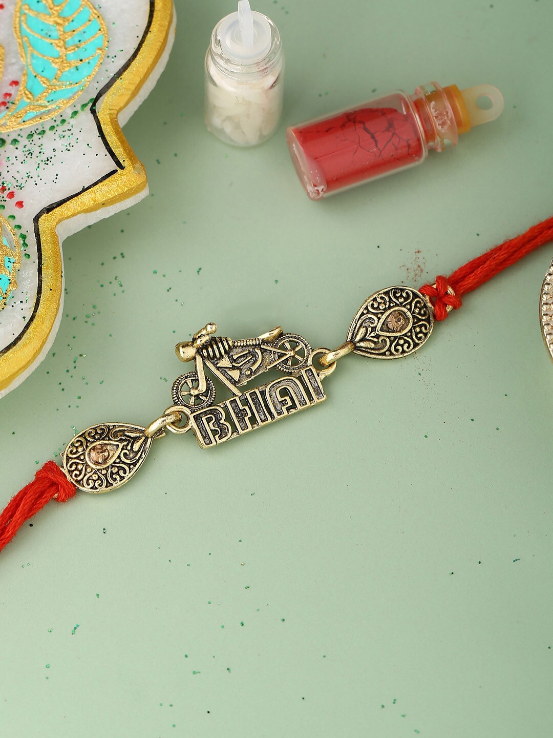

Voylla Stylish Biker Bhai Rakhi with Roli Chaawal Pack, Gold