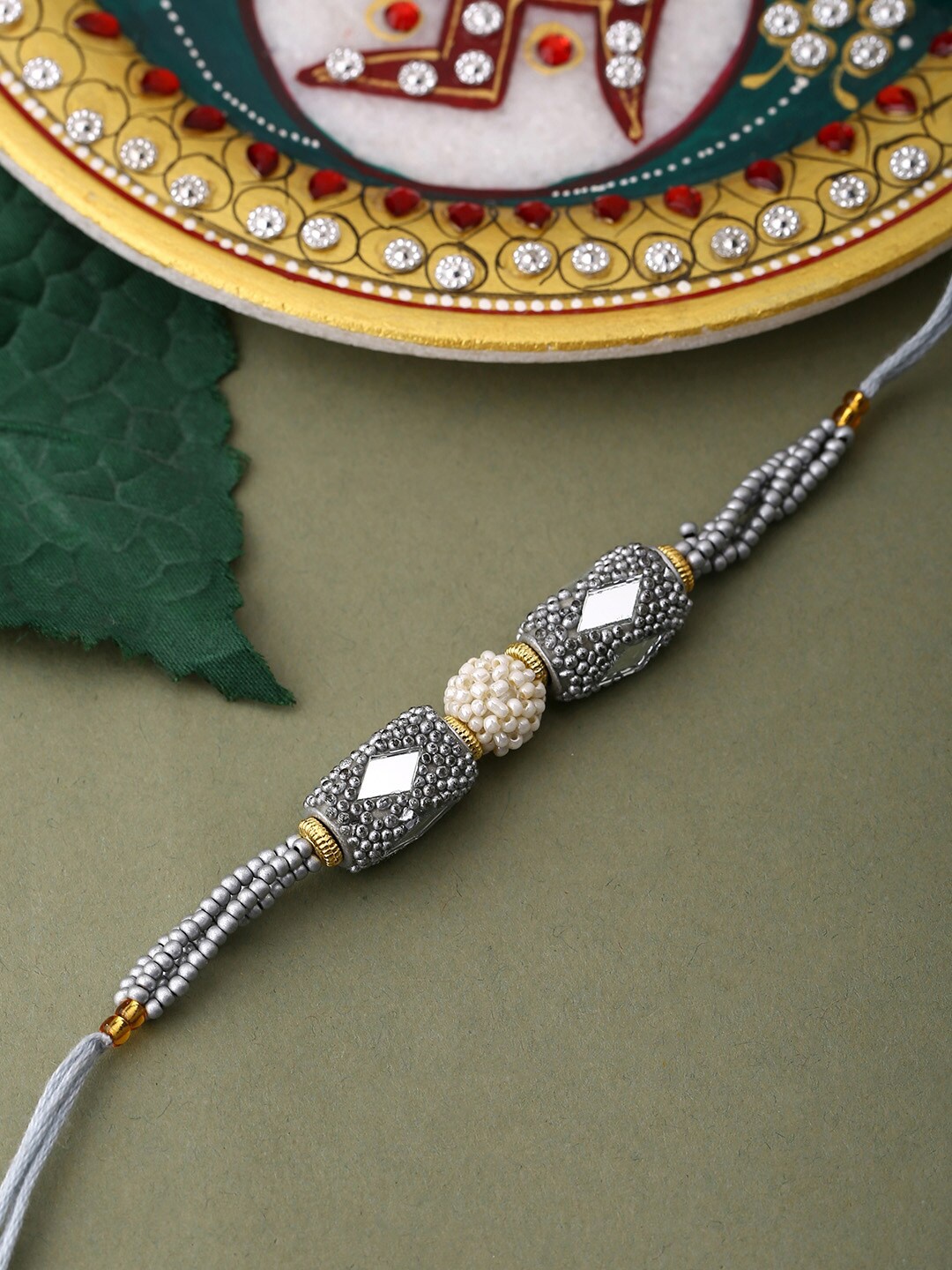 

Voylla Unisex Silver Beaded and Pearls Rakhi with Roli Chaawal Pack, Blue
