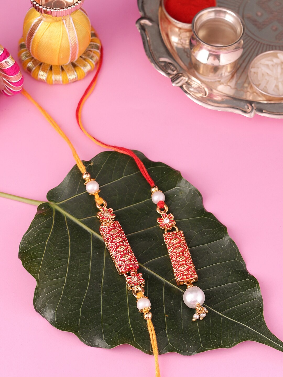 

Voylla Red Floral Pearl Bhaiya Bhabhi Rakhi Set