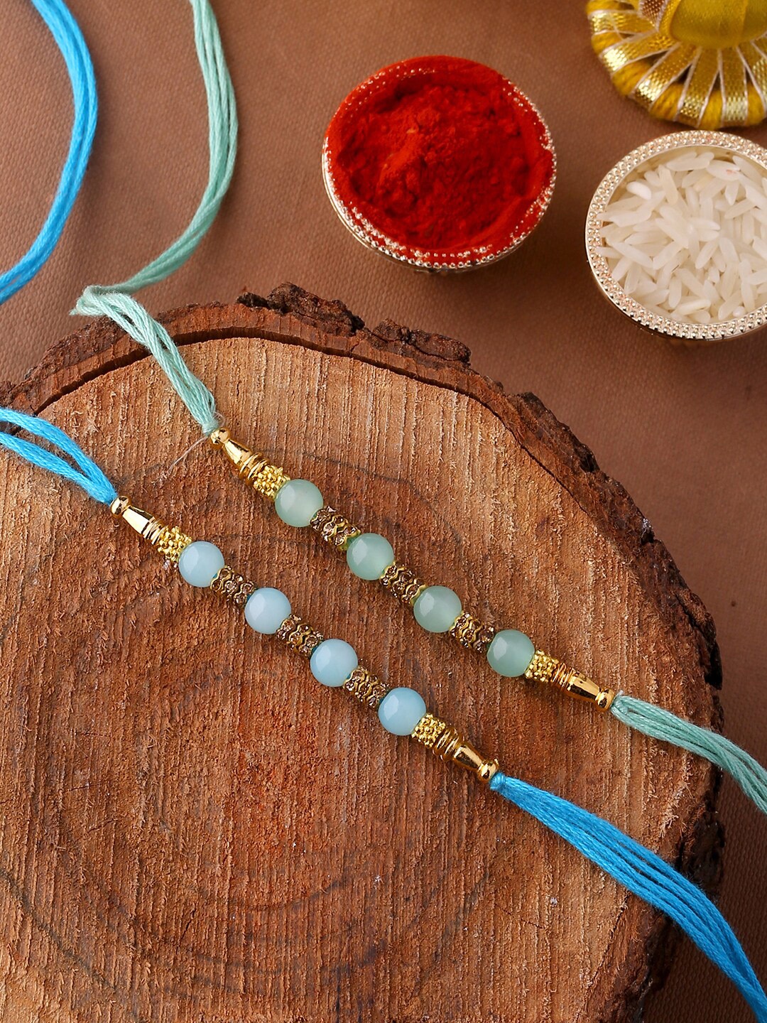 

Voylla Dazzling Rakhi Set of Two with Roli Chaawal Pack, Blue