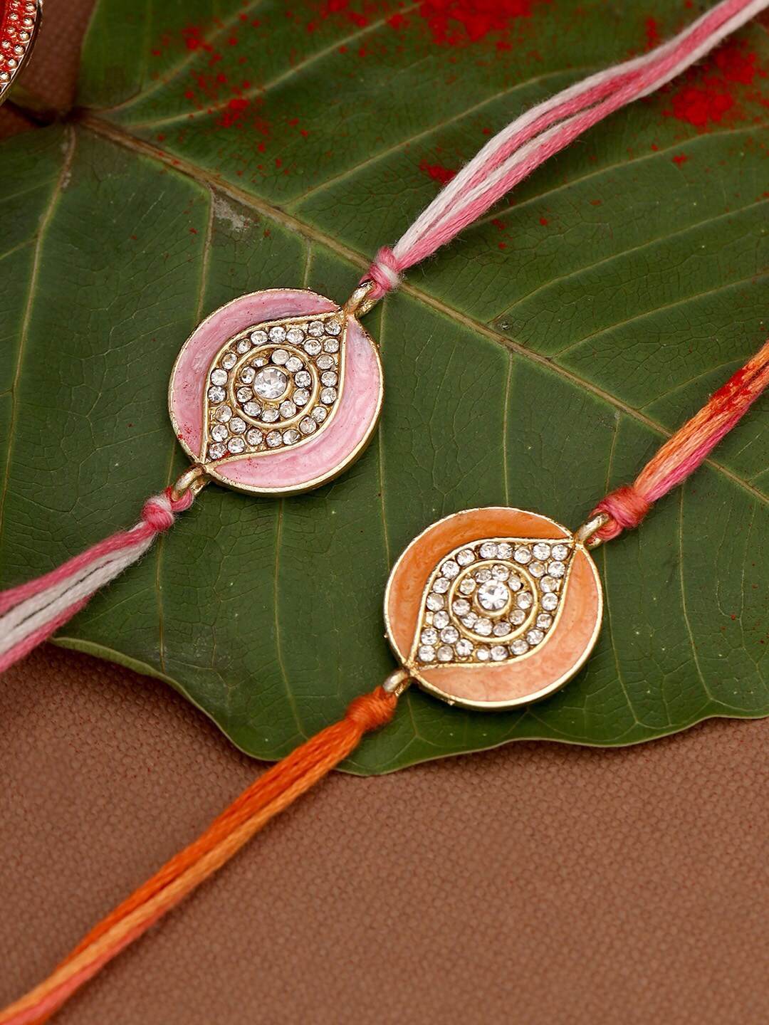 

Voylla Enameled Rakhi Combo Set with Roli Chaawal Pack, Pink