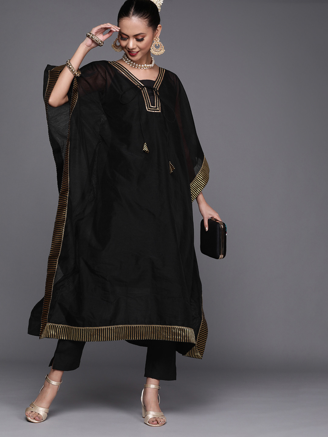 

Inddus Women Black Yoke Design Tasselled Kaftan Kurta with Trousers
