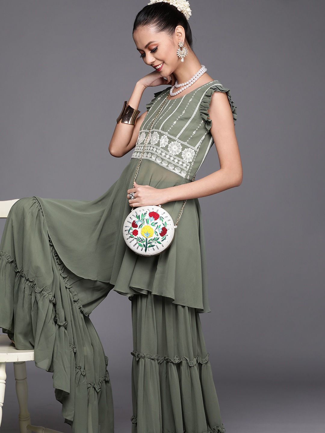 

Inddus Women Green & White Embroidered Deep Neck Kurta with Sharara