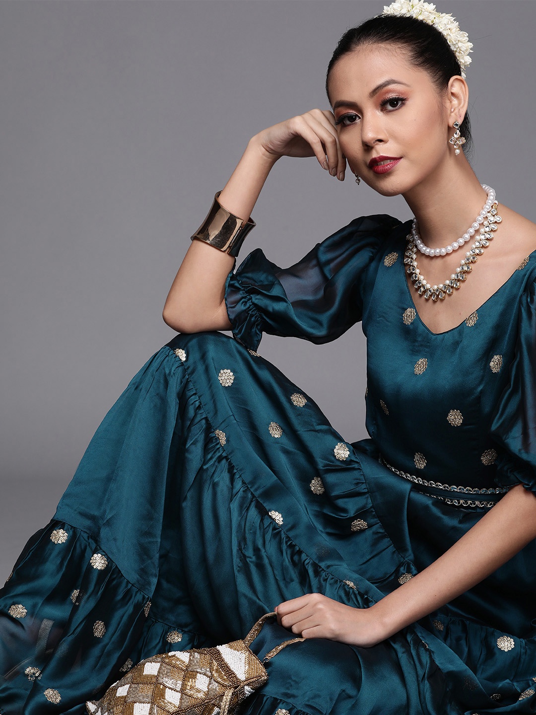

Inddus Teal Blue Ethnic Motifs Embroidered Satin Tiered Gown with Mirror Laced Belt