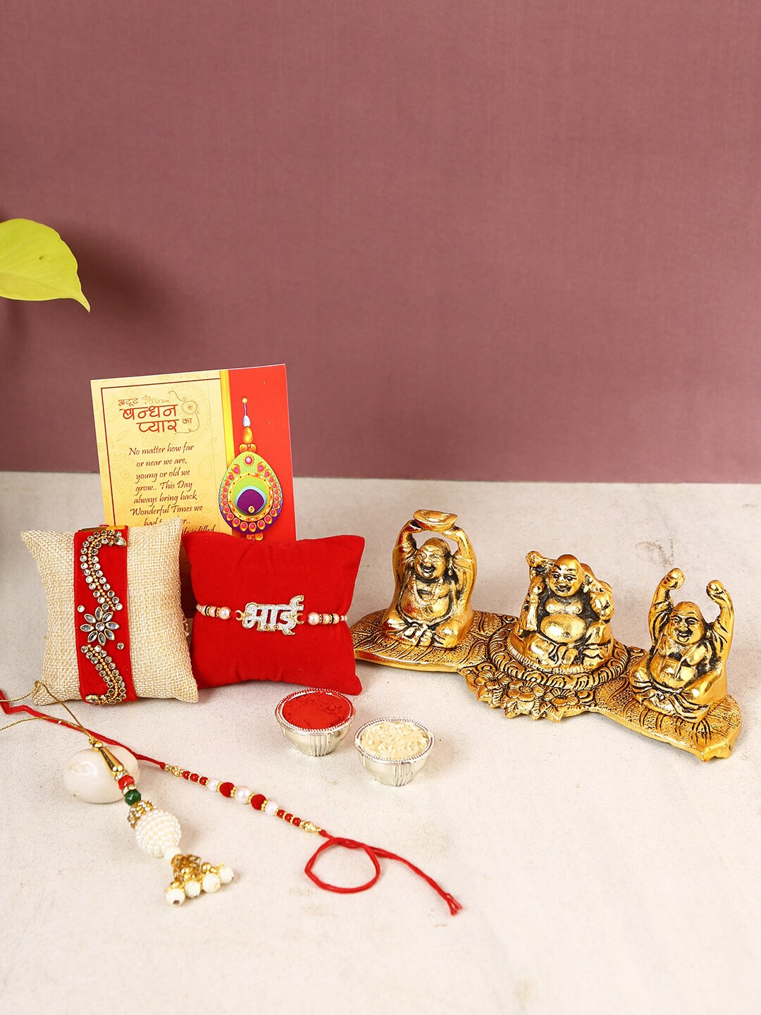 

CraftVatika Set Of 4 Rakhi With Metal Laughing Buddha Idol, Gold