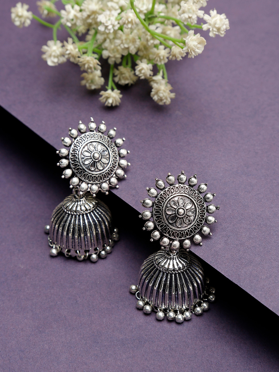 

NEUDIS Silver-Toned Dome Shaped Jhumka Earrings