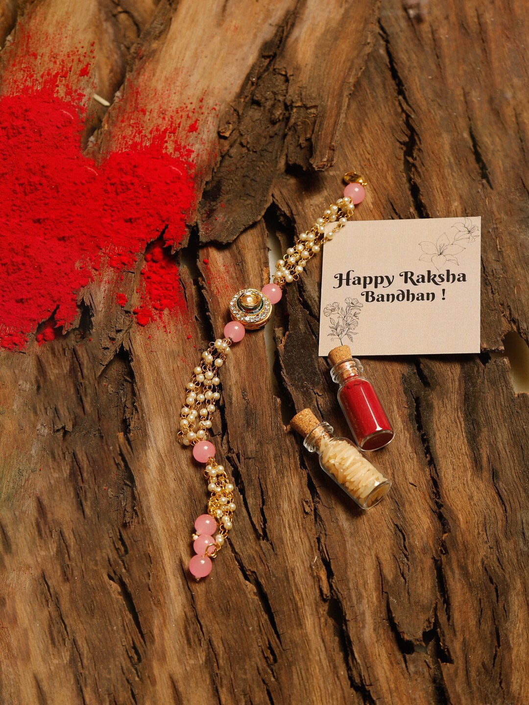 

Ruby Raang Pink & Gold Kundan Beaded Rakhi Gift Box With Roli, Chawal & Greeting Card