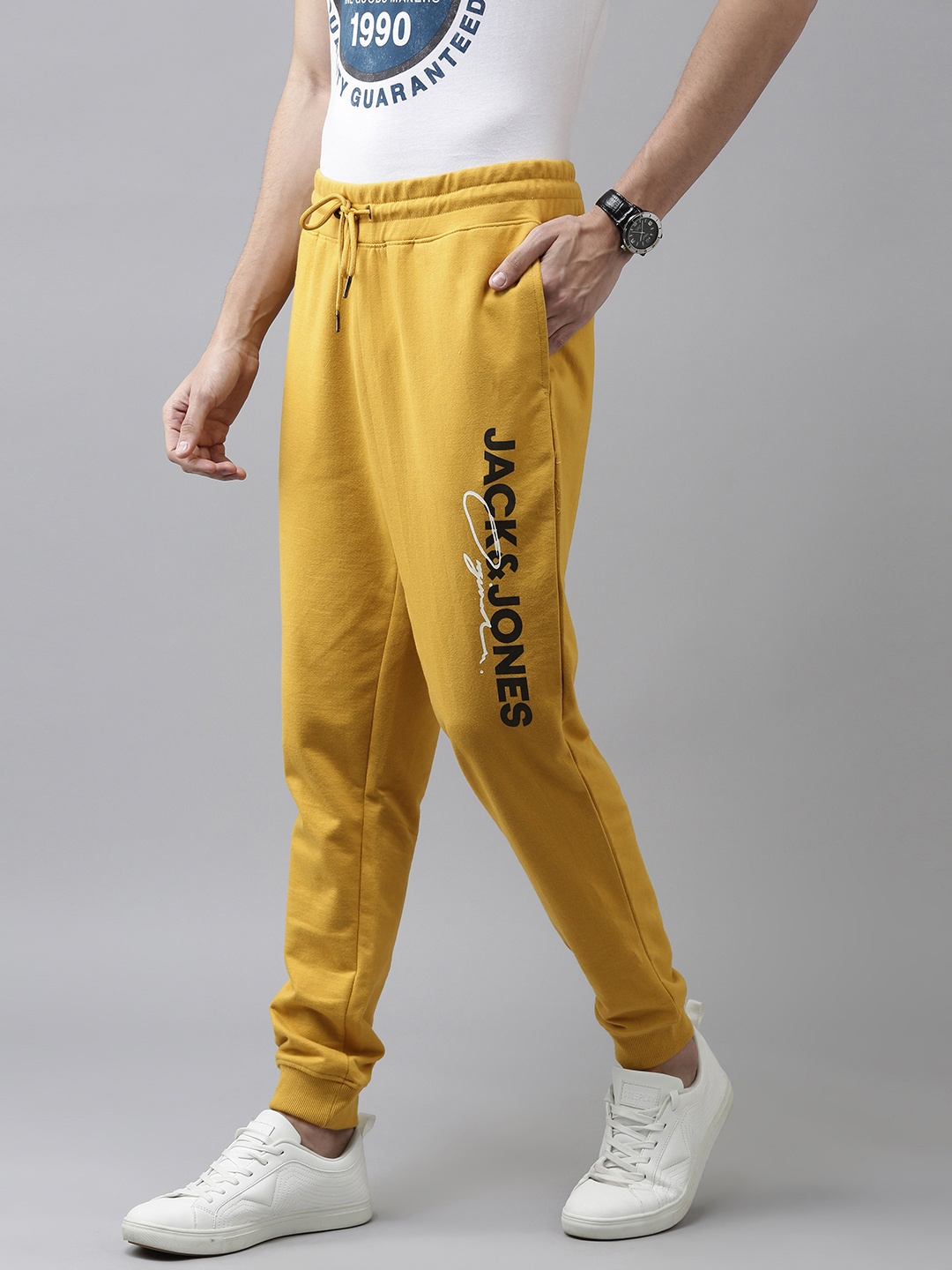 

Jack & Jones Men Yellow Solid Regular Fit Jogger Sweat Pants With Logo Print