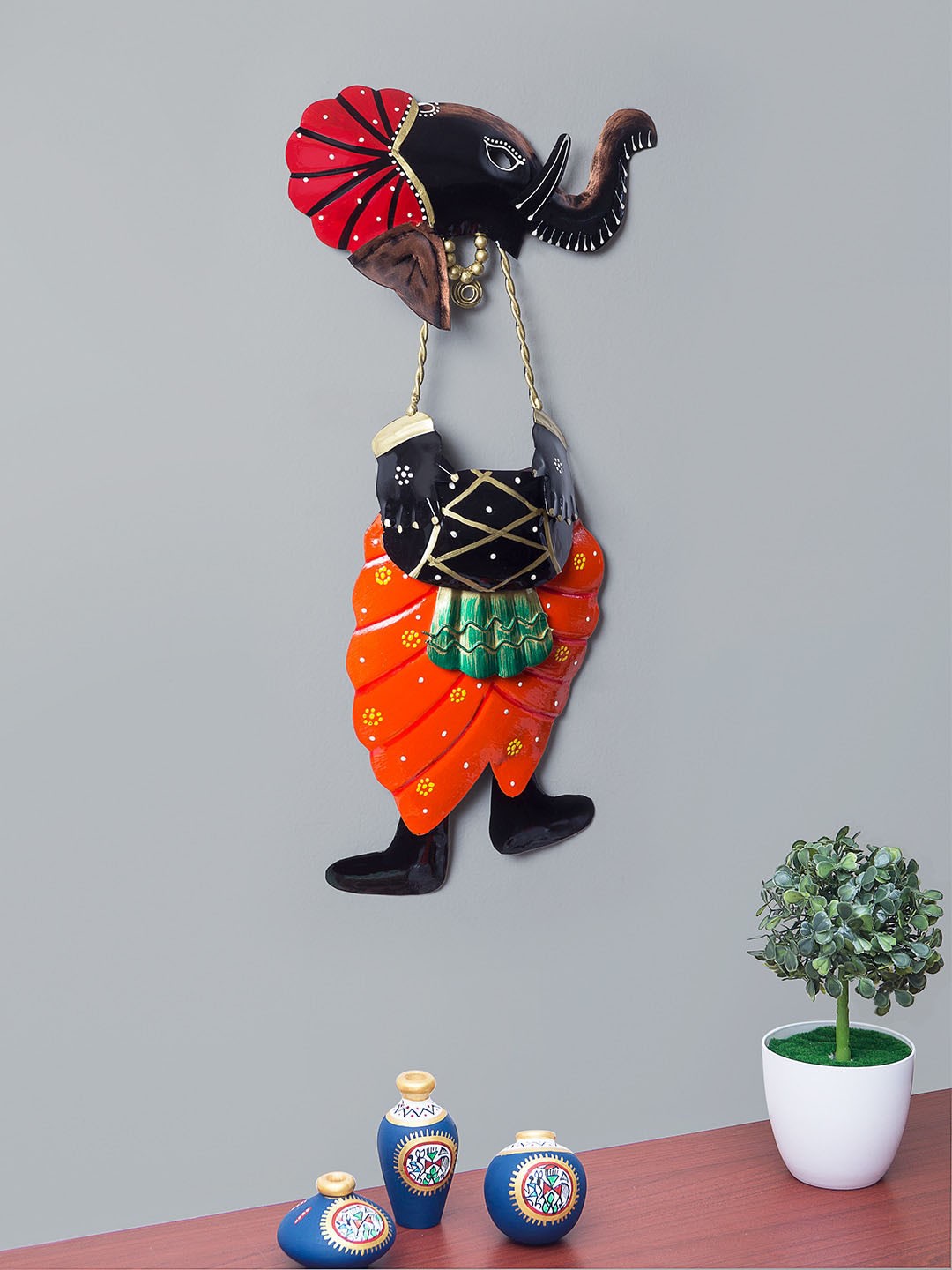 

Golden Peacock Orange & Black Lord Ganesha Playing Dholak Wrought Iron Wall Hanging Decor