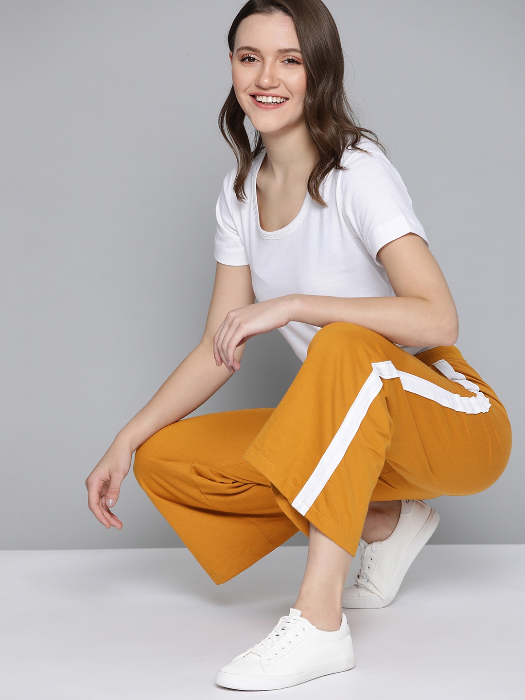 

Mast & Harbour Women Mustard Yellow Striped Detail Track Pants