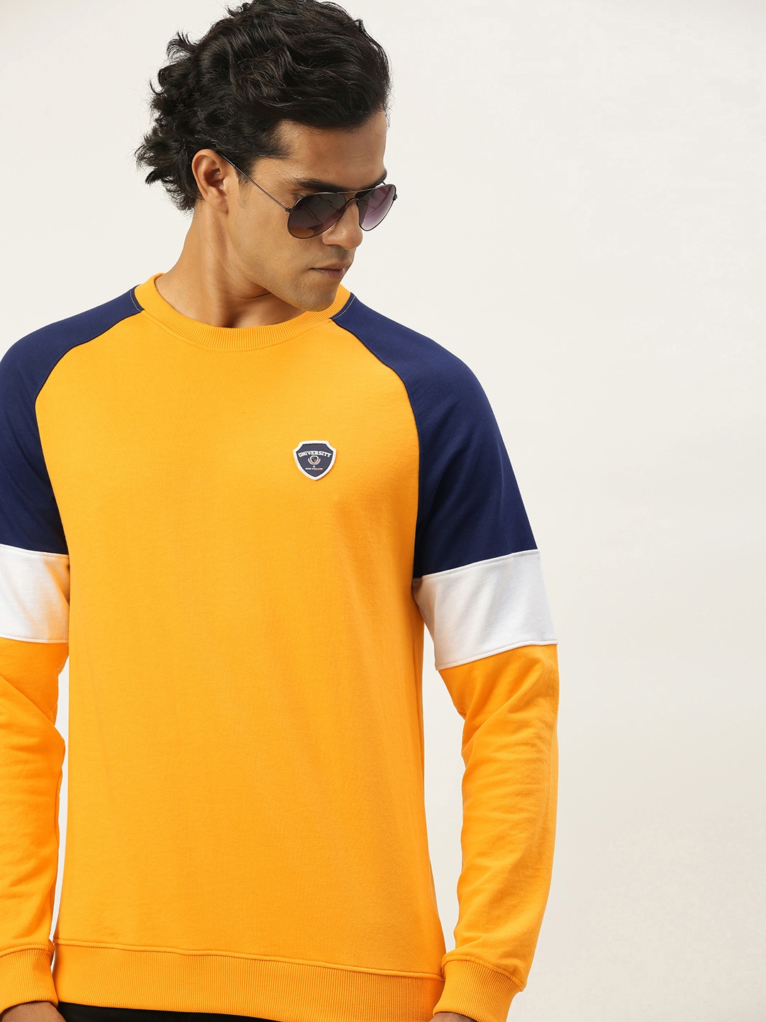 

PETER ENGLAND UNIVERSITY Men Yellow Self-design Applique Sweatshirt
