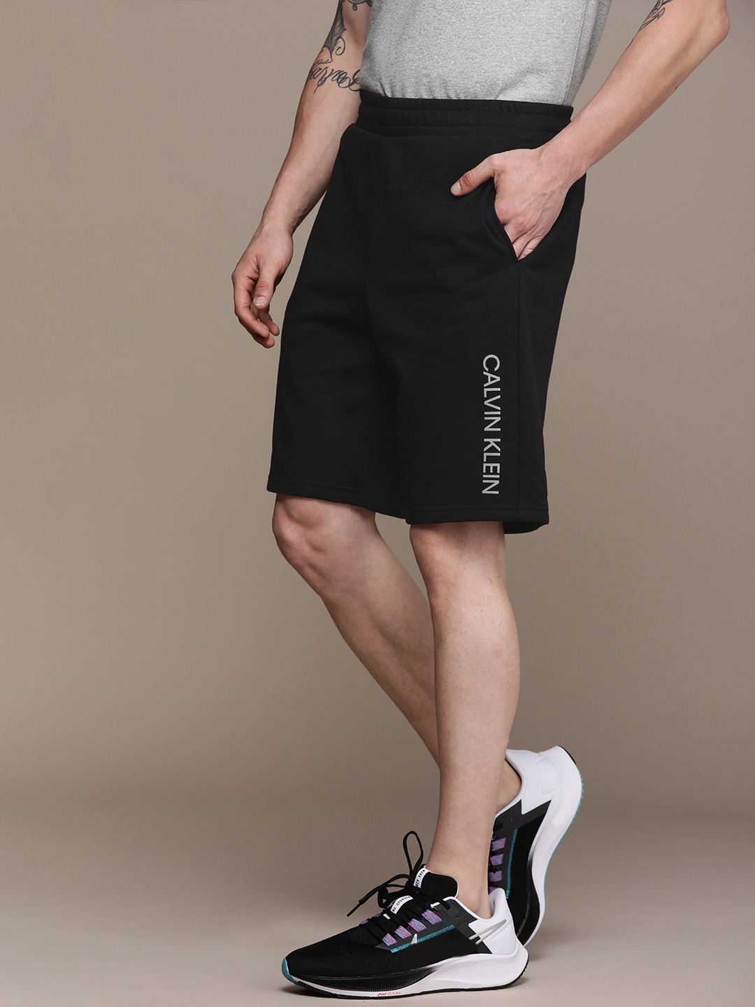 

Calvin Klein Jeans Men Black Logo Printed Regular Shorts