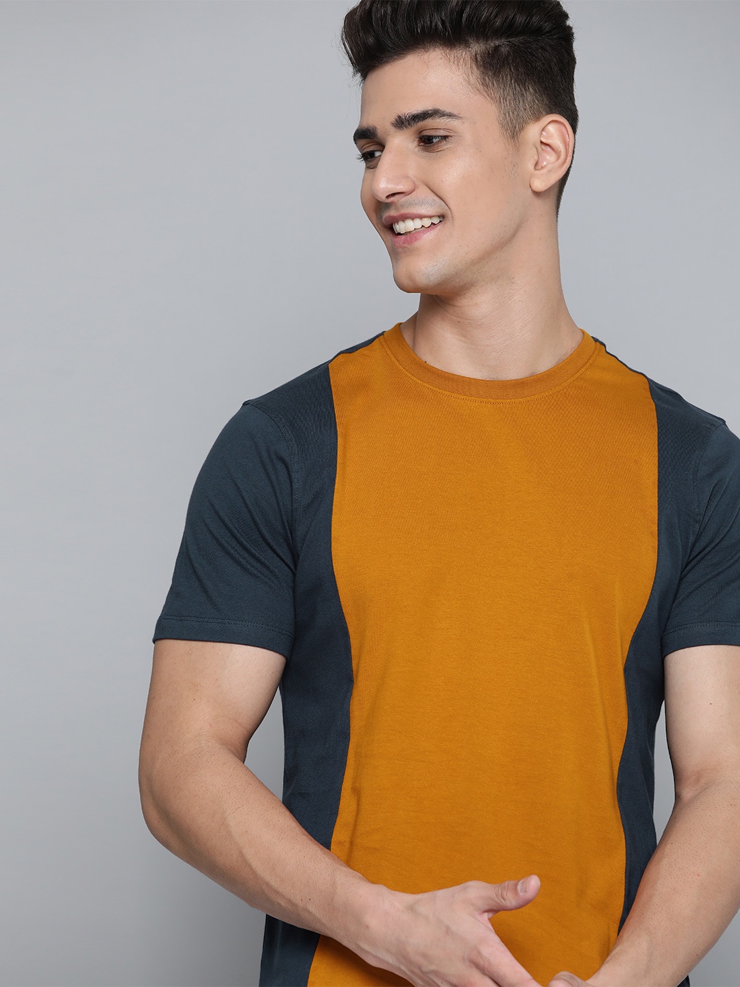 

Mast & Harbour Men Mustard Yellow & Navy Blue Colourblocked Cotton T-shirt