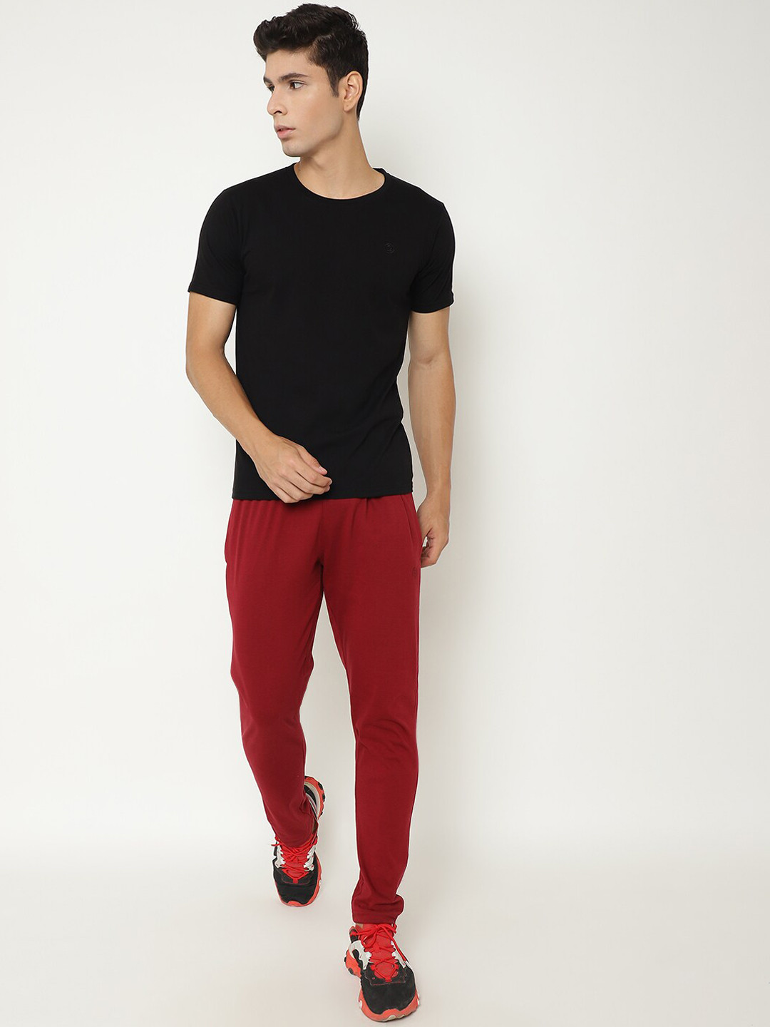

Chkokko Men Black & Maroon Solid Cotton Tracksuit