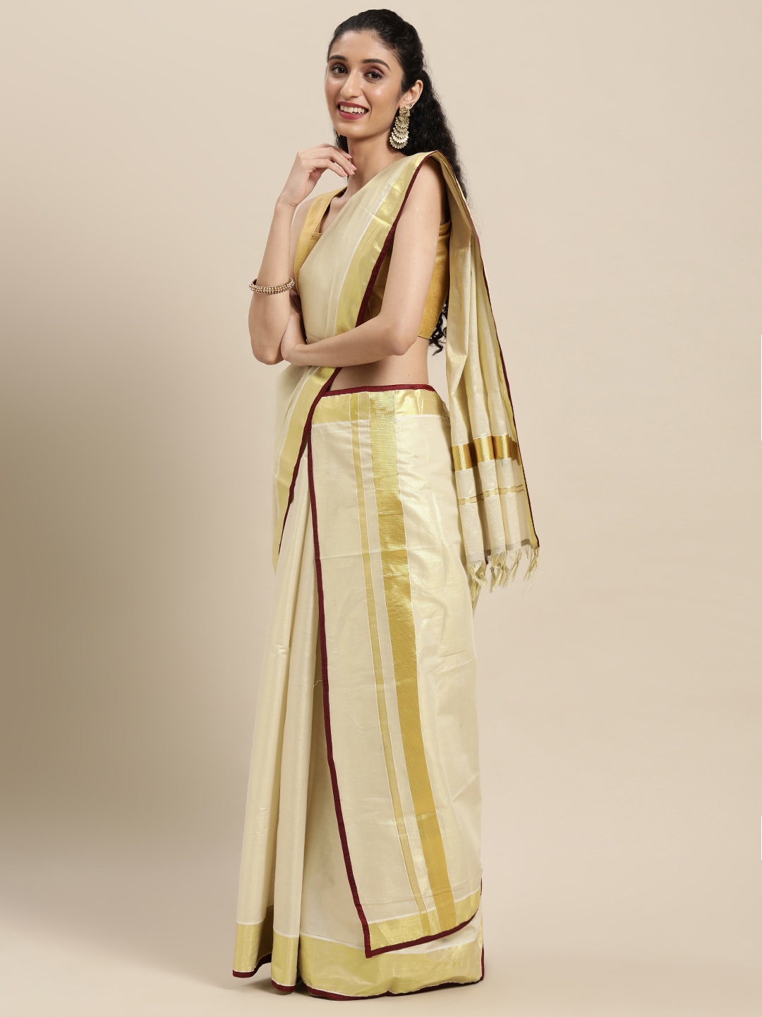

Thara Sarees Off White & Gold-Toned Ethnic Motifs Zari Kasavu Saree