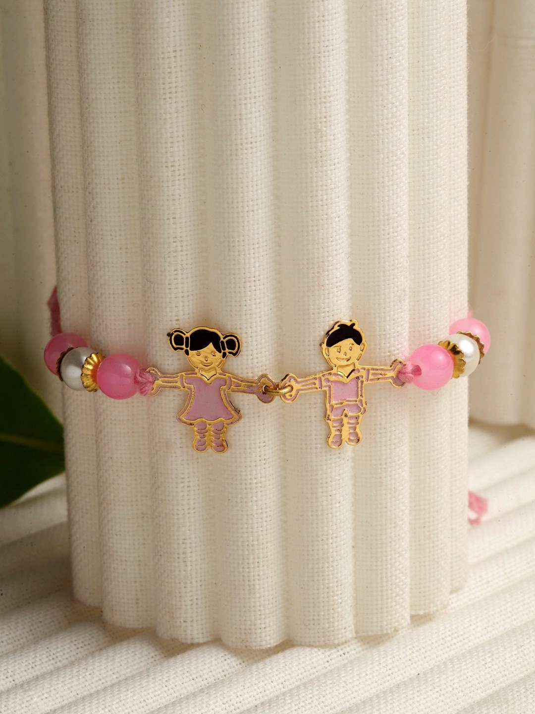 

PANASH Gold-Toned & Pink Brass Handcrafted Rakhi