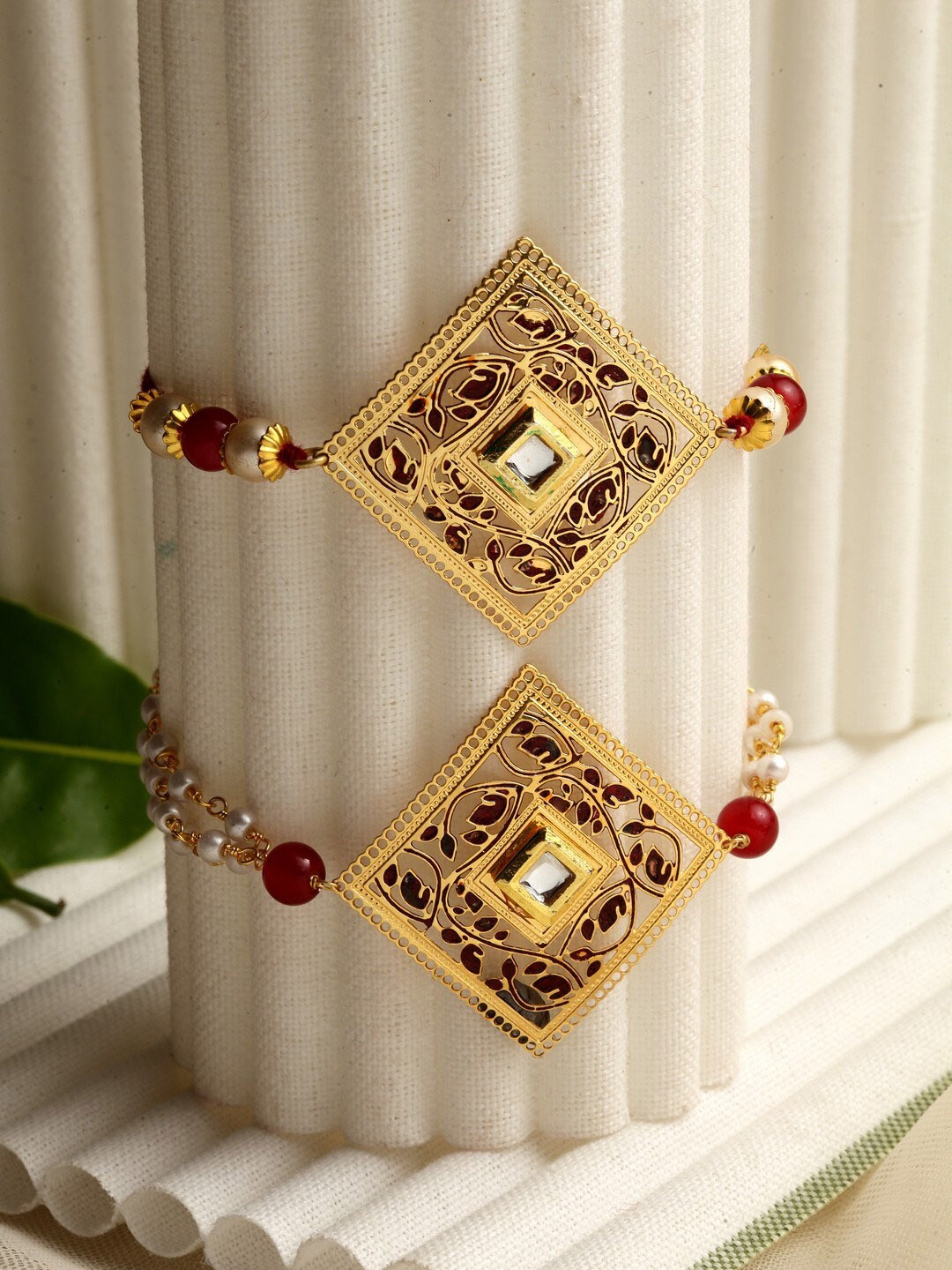 

PANASH Set of 2 Gold-Plated Handcrafted Kundan Lumba & Rakhi