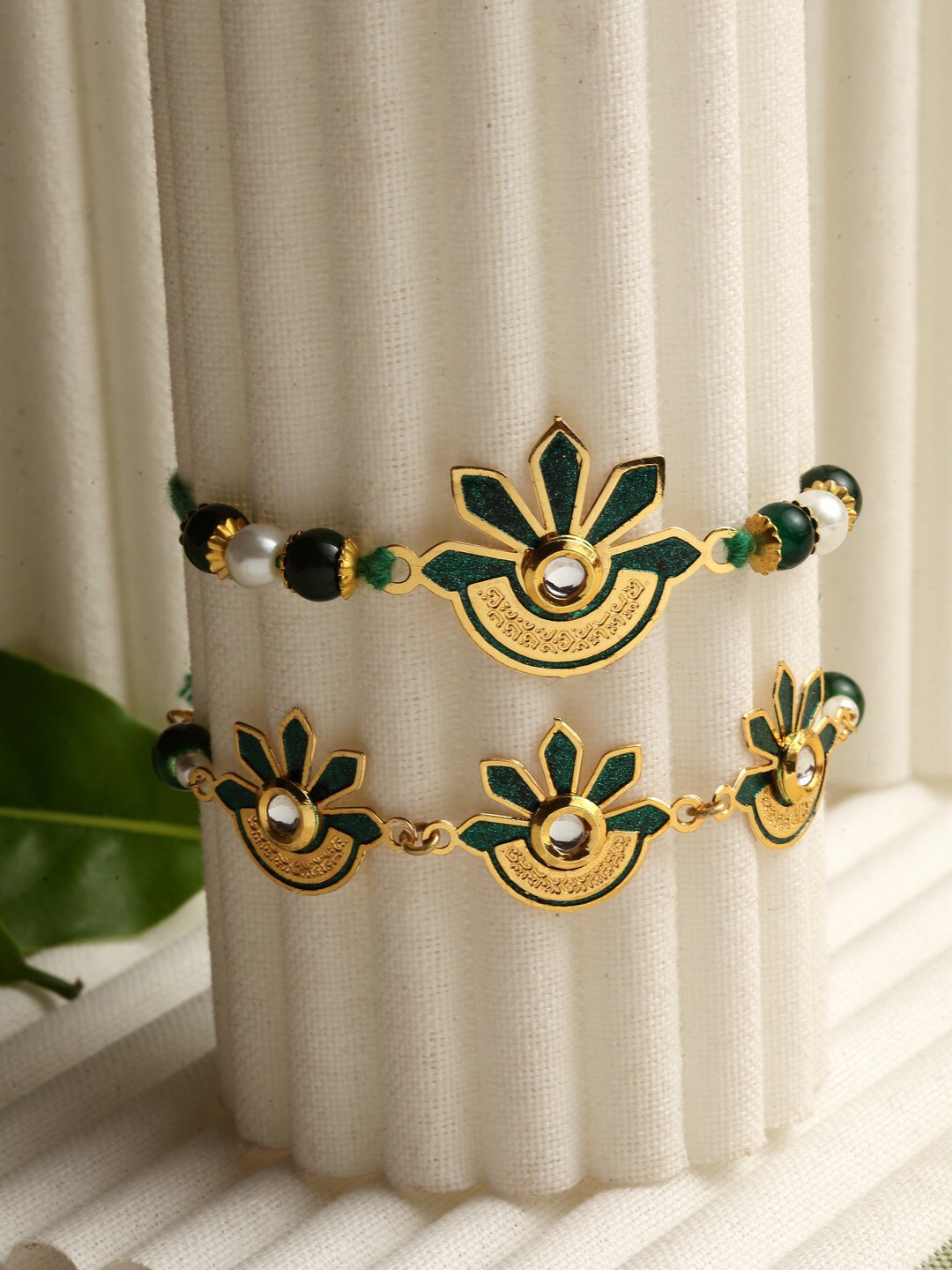 

PANASH Set of 2 Gold-Plated & Green Brass Handcrafted Lumba & Rakhi