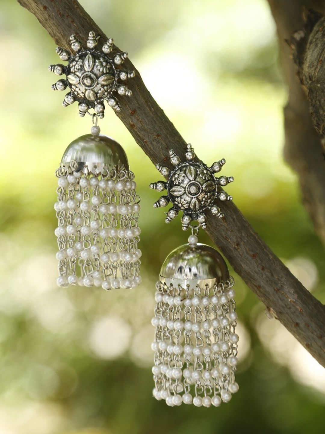 

NEUDIS Silver-Toned Contemporary Jhumkas Earrings