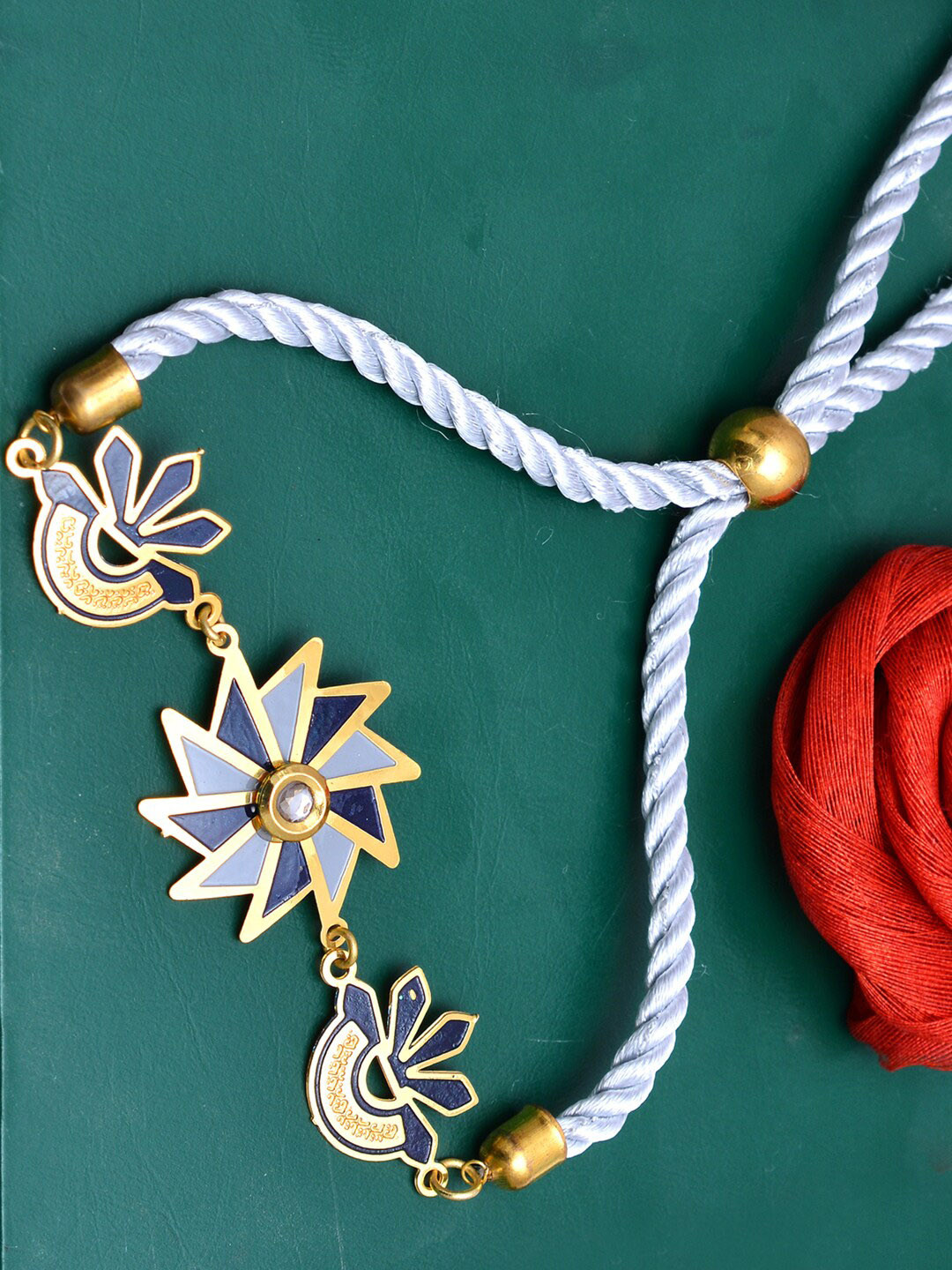 

PANASH Gold & Blue Brass Handcrafted Rakhi With Roli Chawal